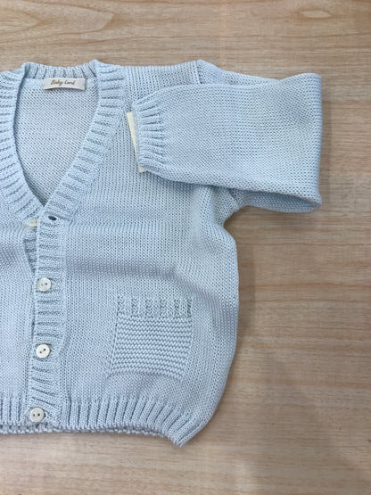 Cardigan Baby Lord in filo celeste con scollo tasche e piccoli bottoncini