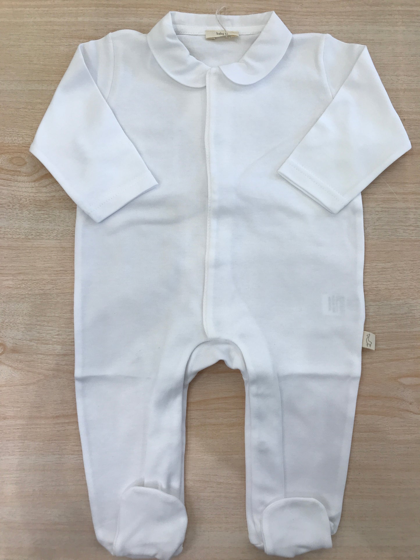 Tutina Baby Gi in cotone manica lunga con piedini con chiusura antipanico e sul retro ali dorate
