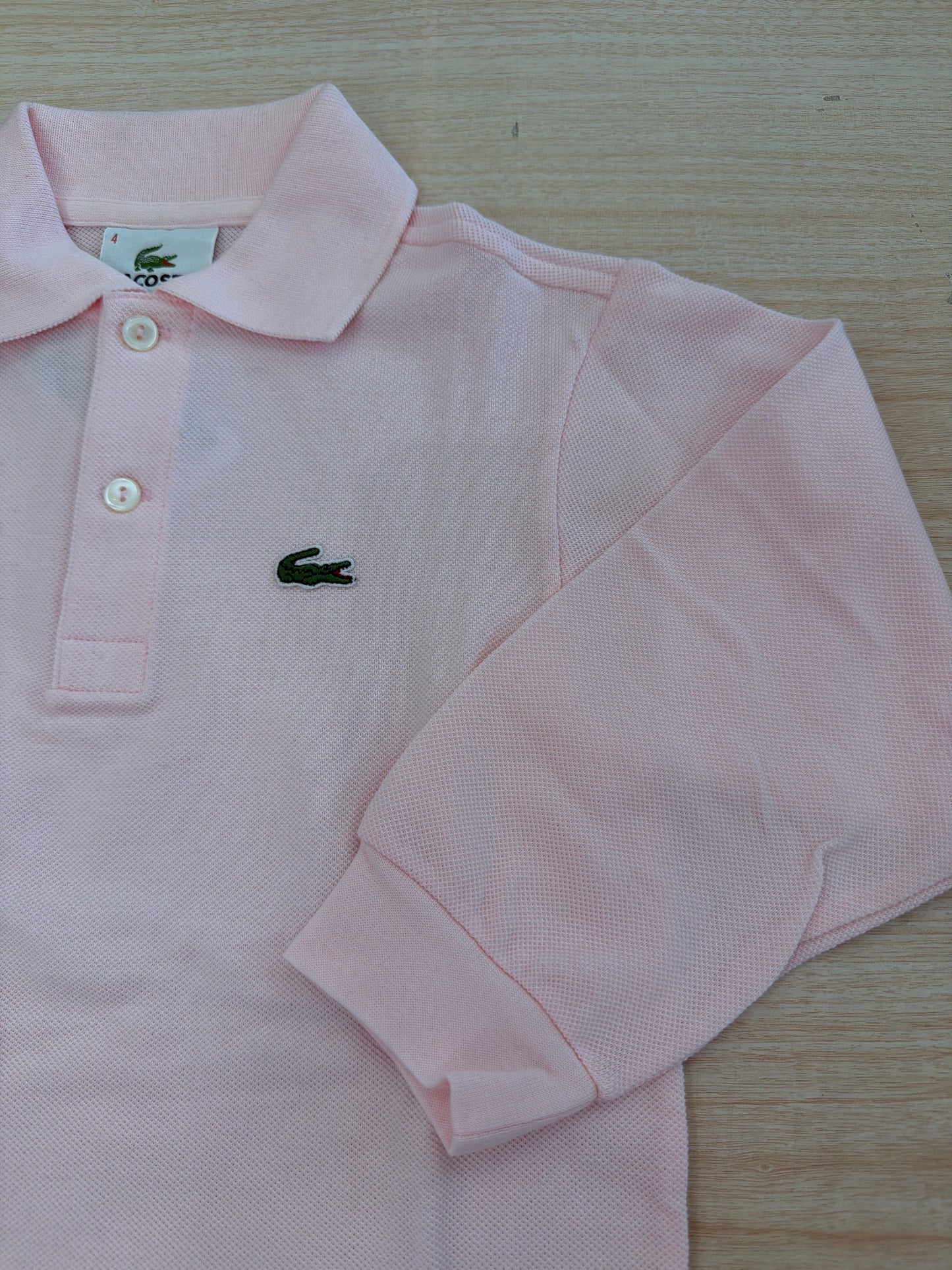 Polo Lacoste in cotone manica lunga con bottoncini e logo ricamato lateralmente unisex
