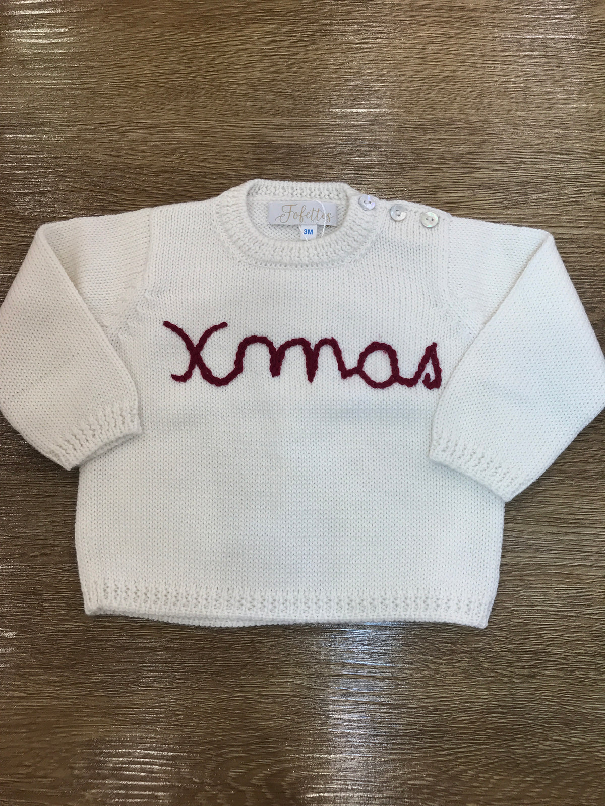 Maglione Fofettes panna con piccoli bottoncini e ricamo rosso sul davanti "xmas"