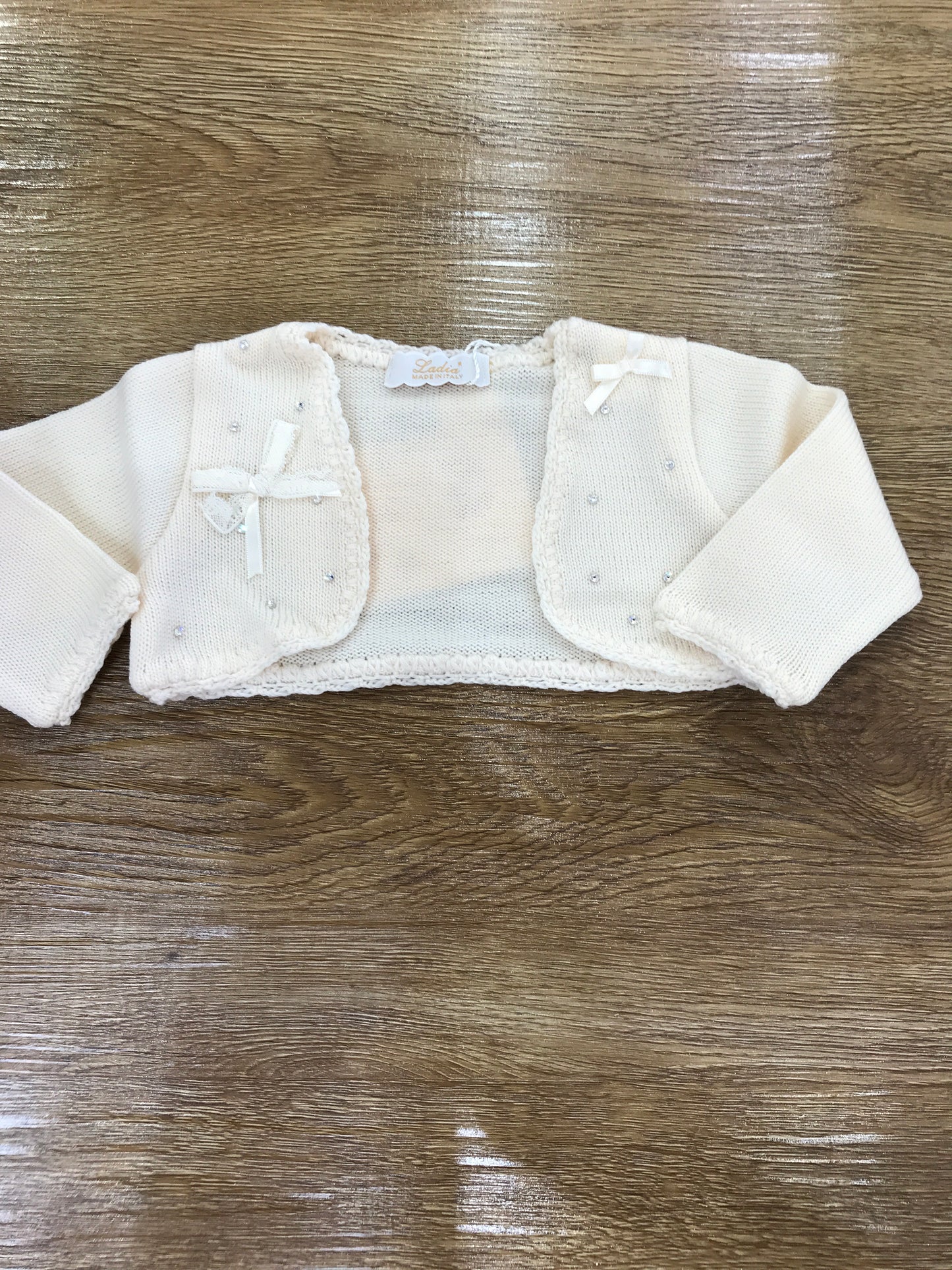 Cardigan Ladia in lana panna con applicazione di brillantini e fiocchetti