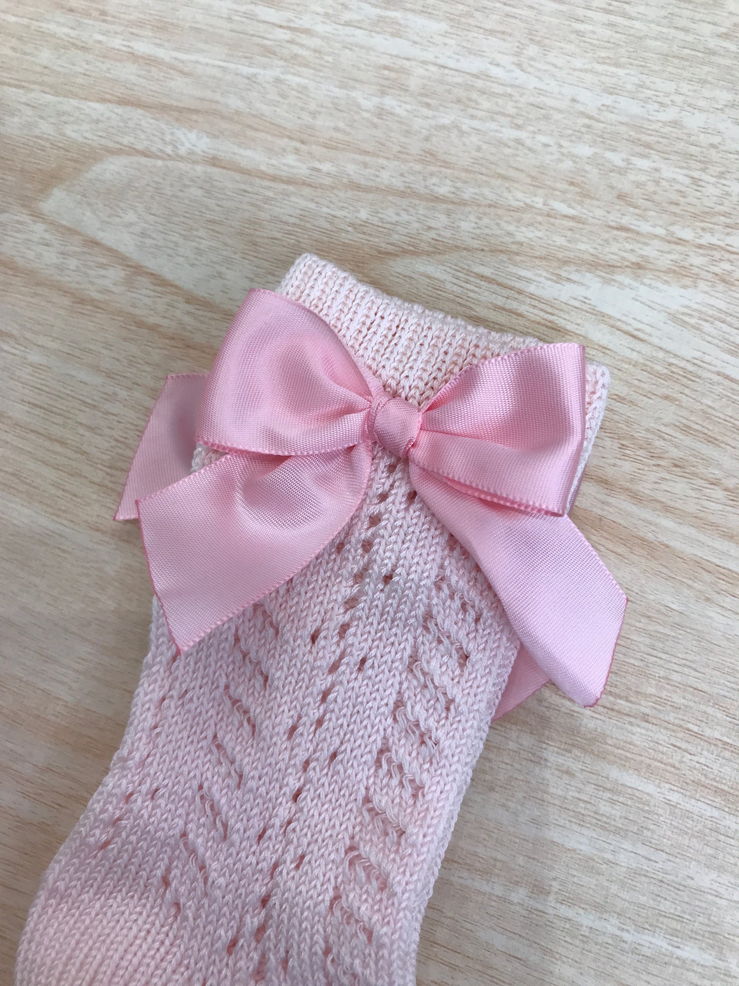 Calzino Story Loris in filo alto traforato rosa con fiocco