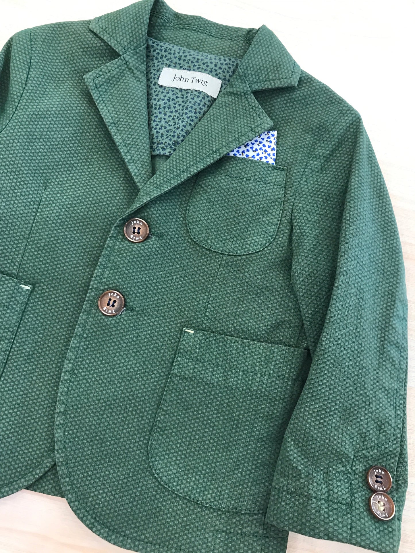 Giacca John Twig verde con tasche sul davanti e pochette laterale