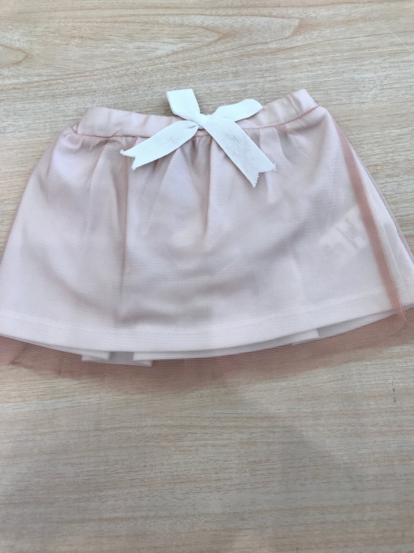 Gonna Coccodè in cotone con strato in tulle rosa con fiocchetto sul davanti