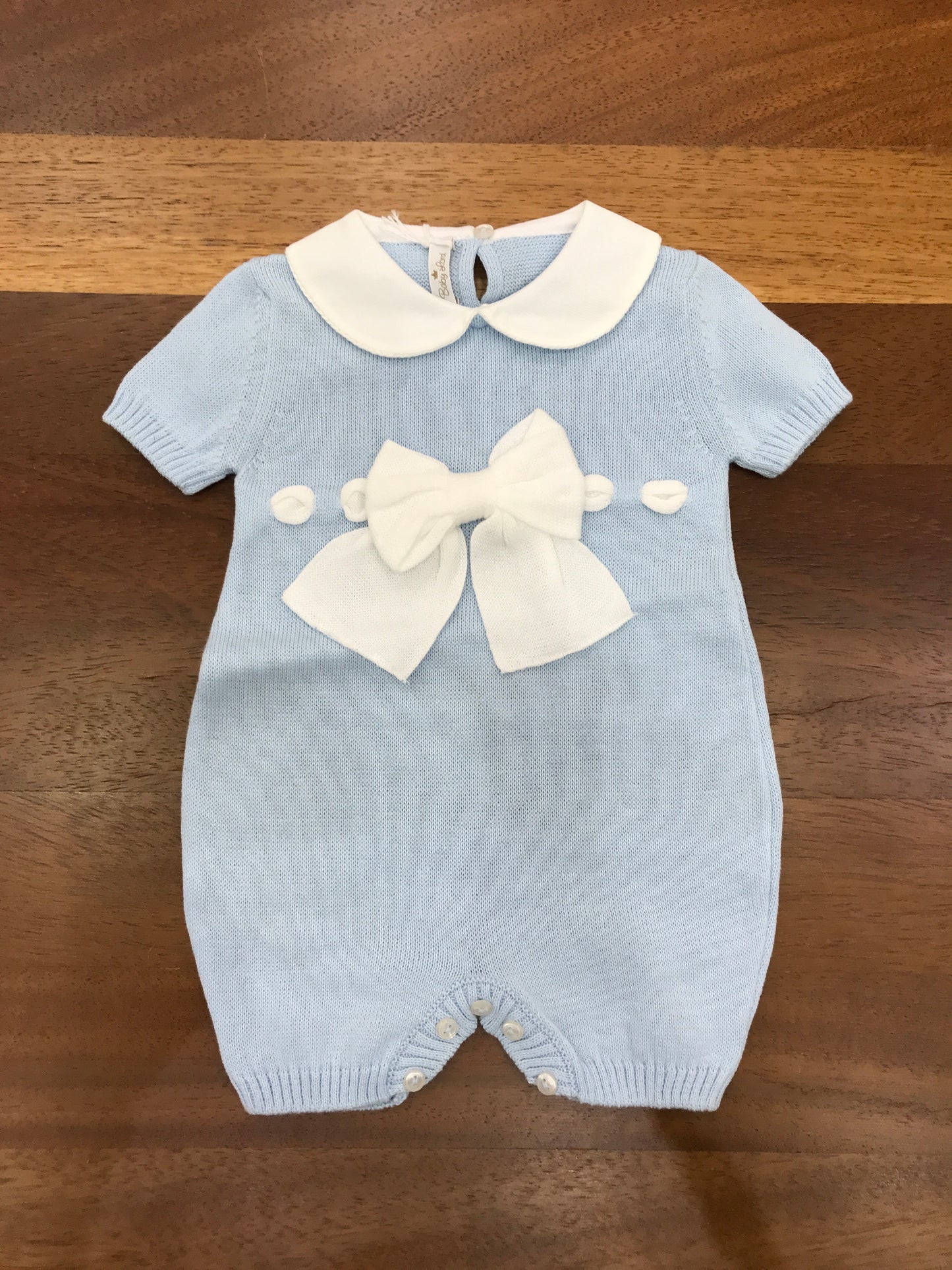Pagliaccetto Baby Lord in filo mezza manica collo tondo bianco con fiocco passanastro bianco