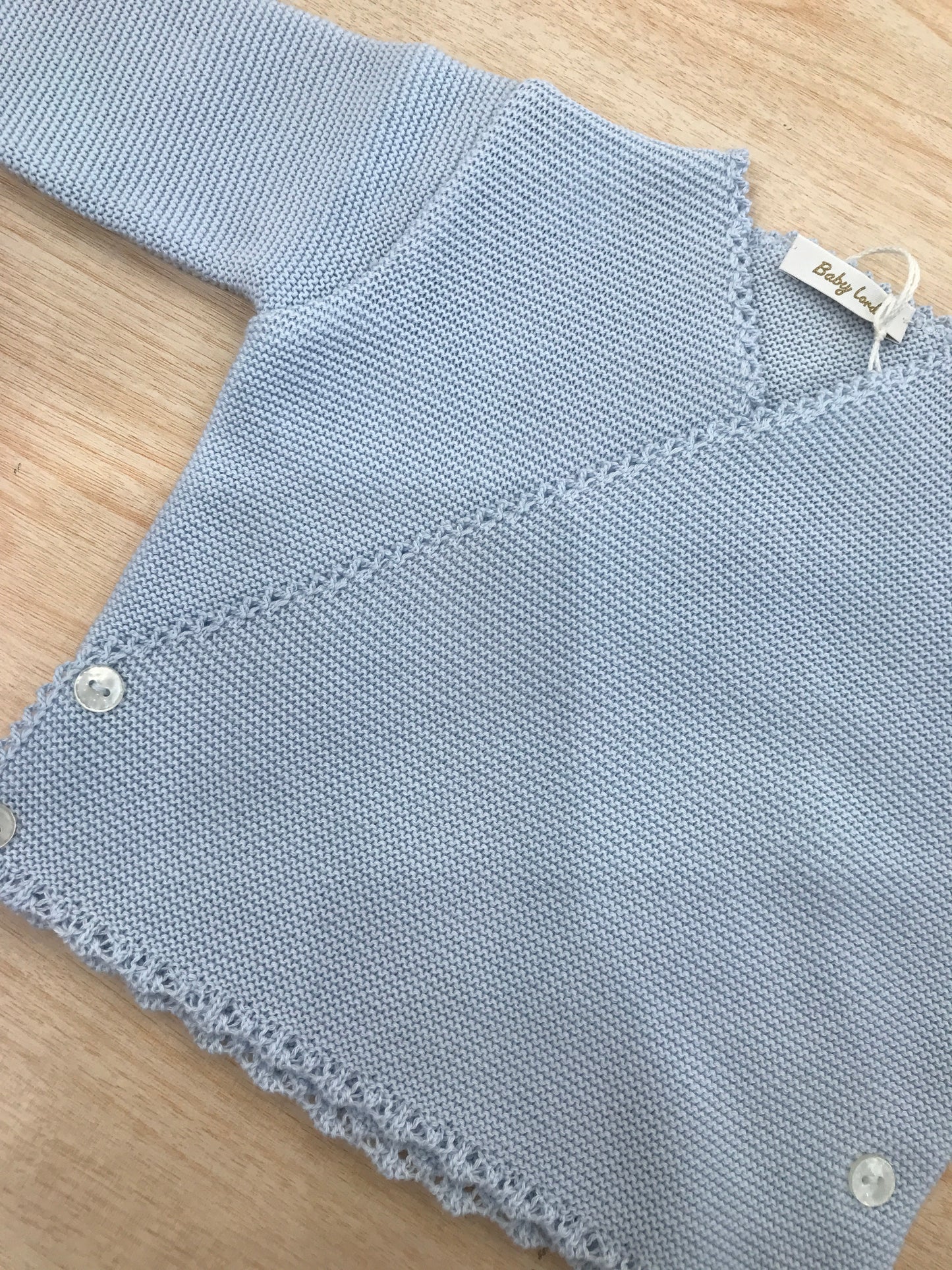 Cardigan Baby Lord in filo celeste ad incrocio smerlato