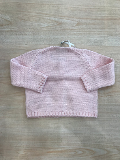 Cardigan Colibrì in filo rosa con bottoni sul davanti con tasche sul davanti e fiocchetti sulle tasche