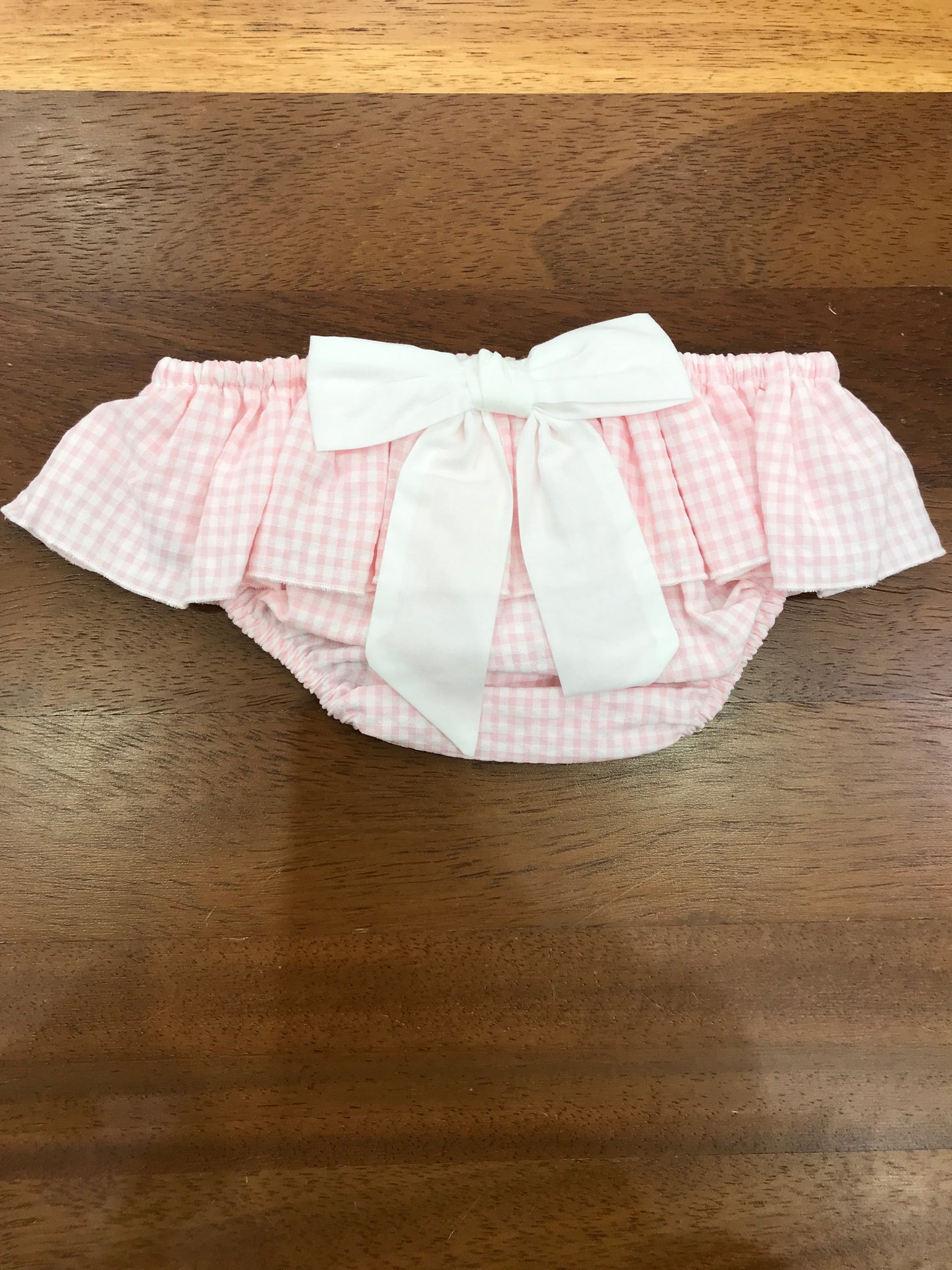 Culotte Baby Gi in cotone rosa a quadretti con rusche con fiocco bianco sul retro