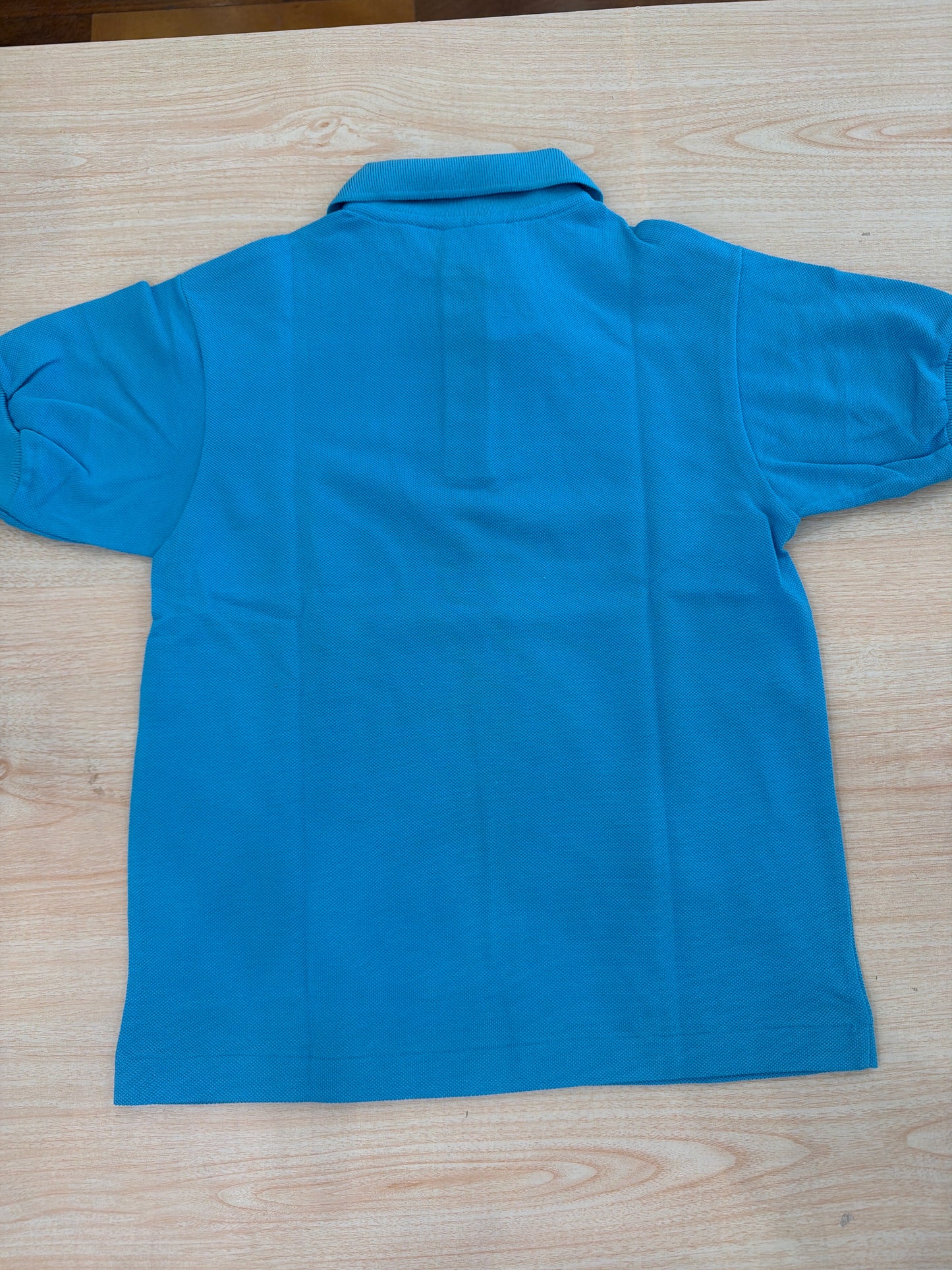 Polo Lacoste in cotone mezza manica con bottoncini e logo ricamato lateralmente unisex