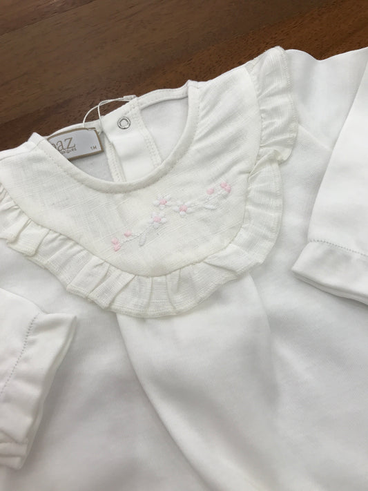 Tutina Paz Rodriguez in cotone rosa manica lunga con piedini collo in lino bianco con rusche con fiori bianchi e rosa
