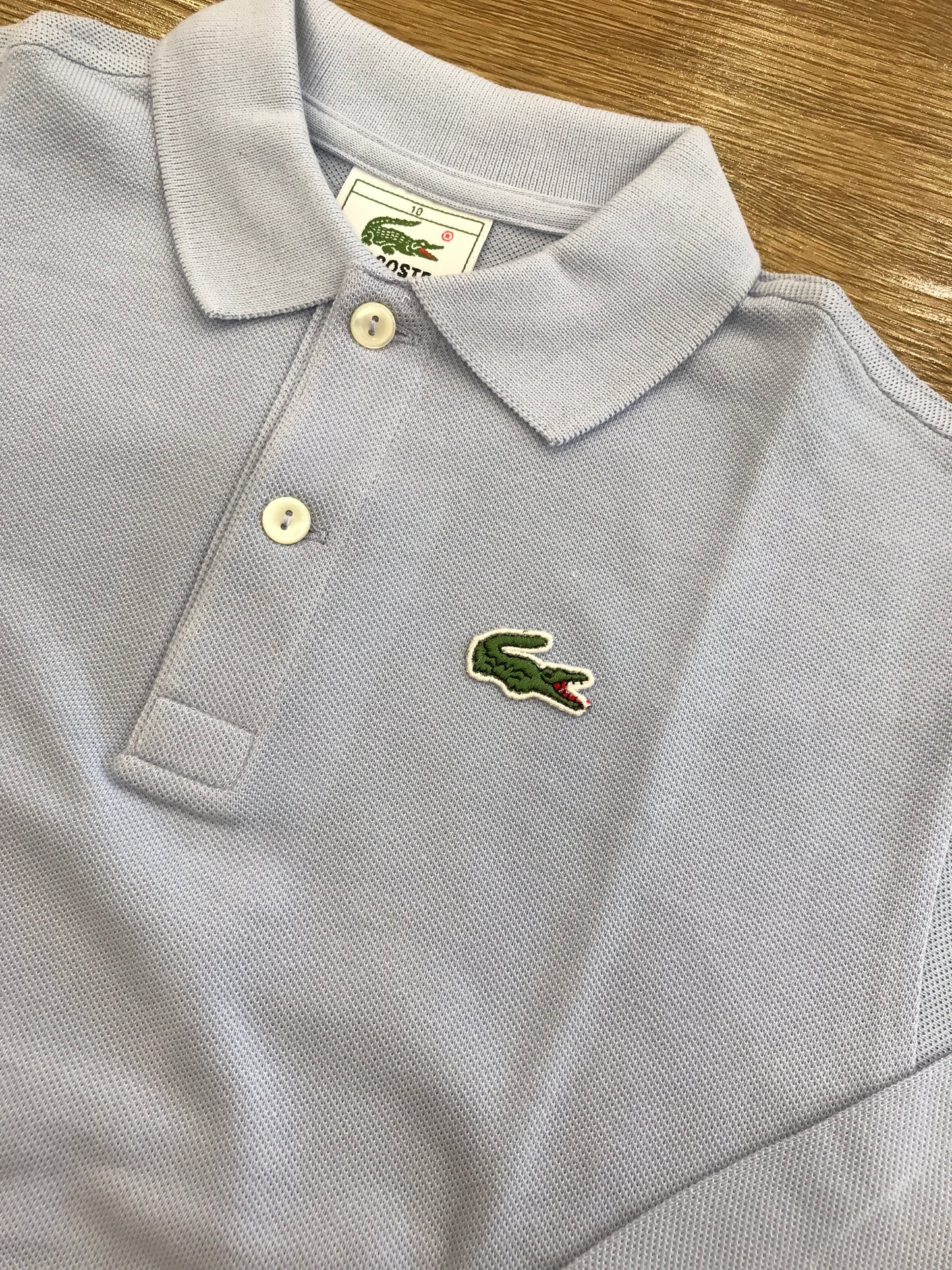 Polo Lacoste manica lunga con polsini e bottoncini