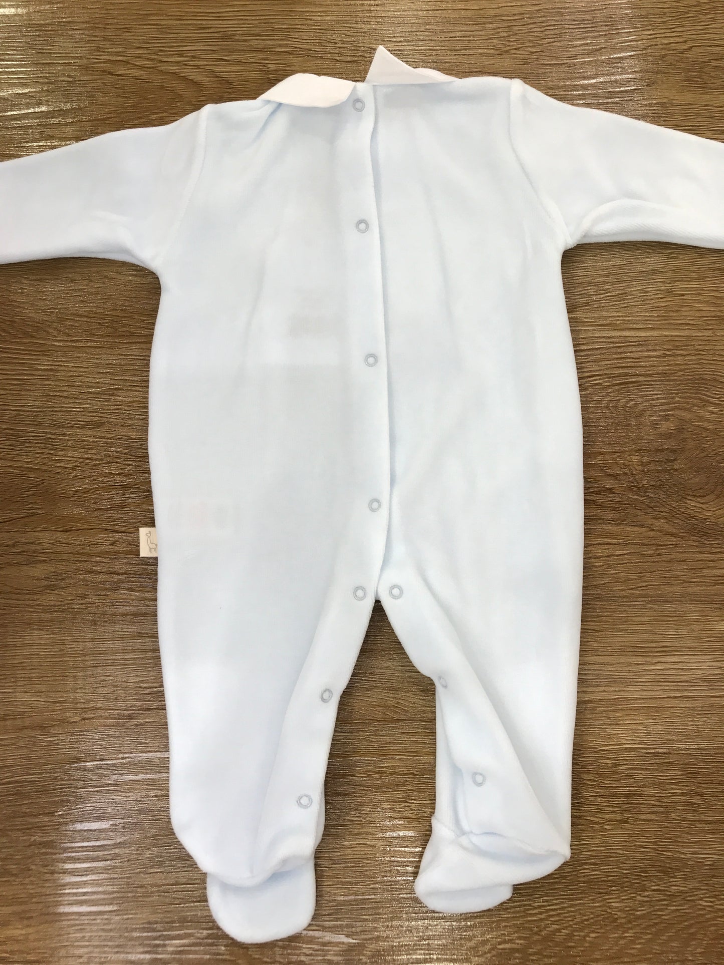 Tutina Baby Gi in ciniglia celeste con orsetto applicato sul davanti con fiocchetto
