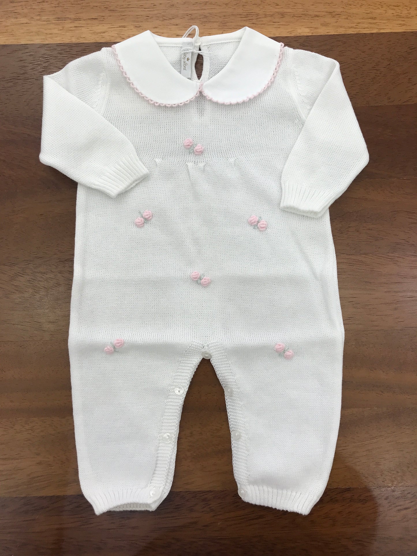 Tutina Baby Lord in filo manica lunga bianca con collo tondo con rose rosa lavorate a mano