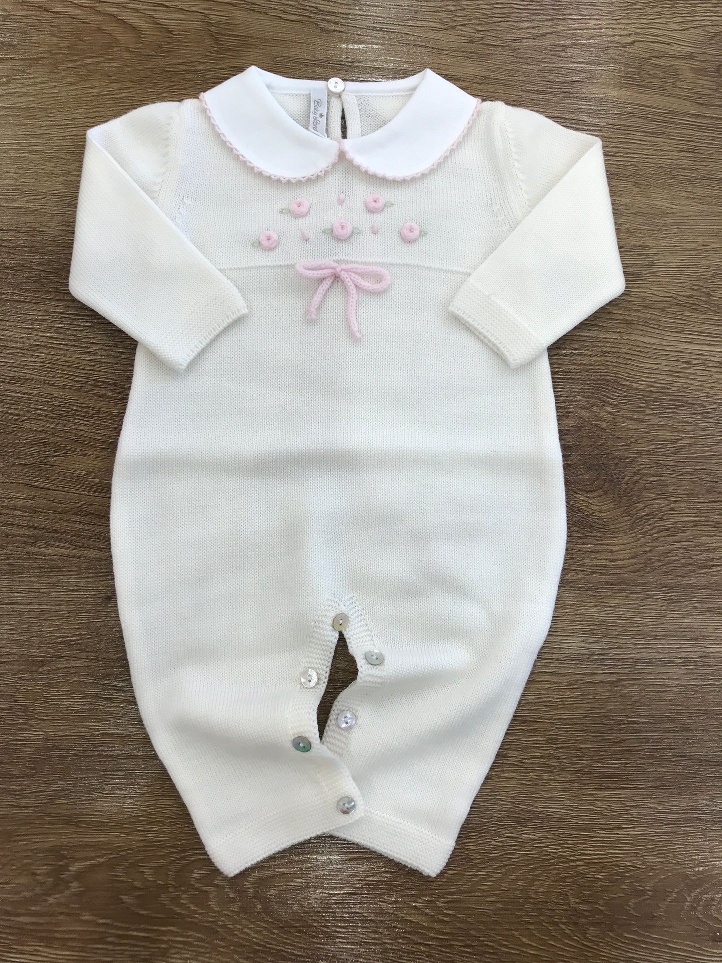 Tutina Baby Lord in lana panna intera con roselline rosa e fiocchetto sul corpetto