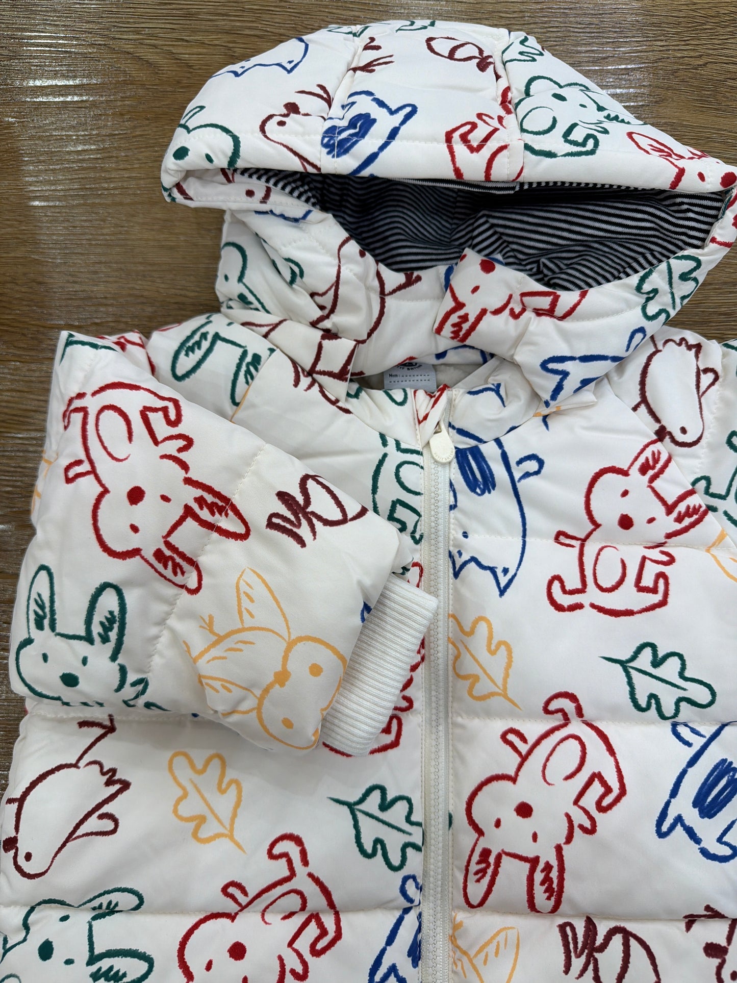 Giubbotto Petit Bateau imbottito con cappuccio con disegni di animaletti colorati