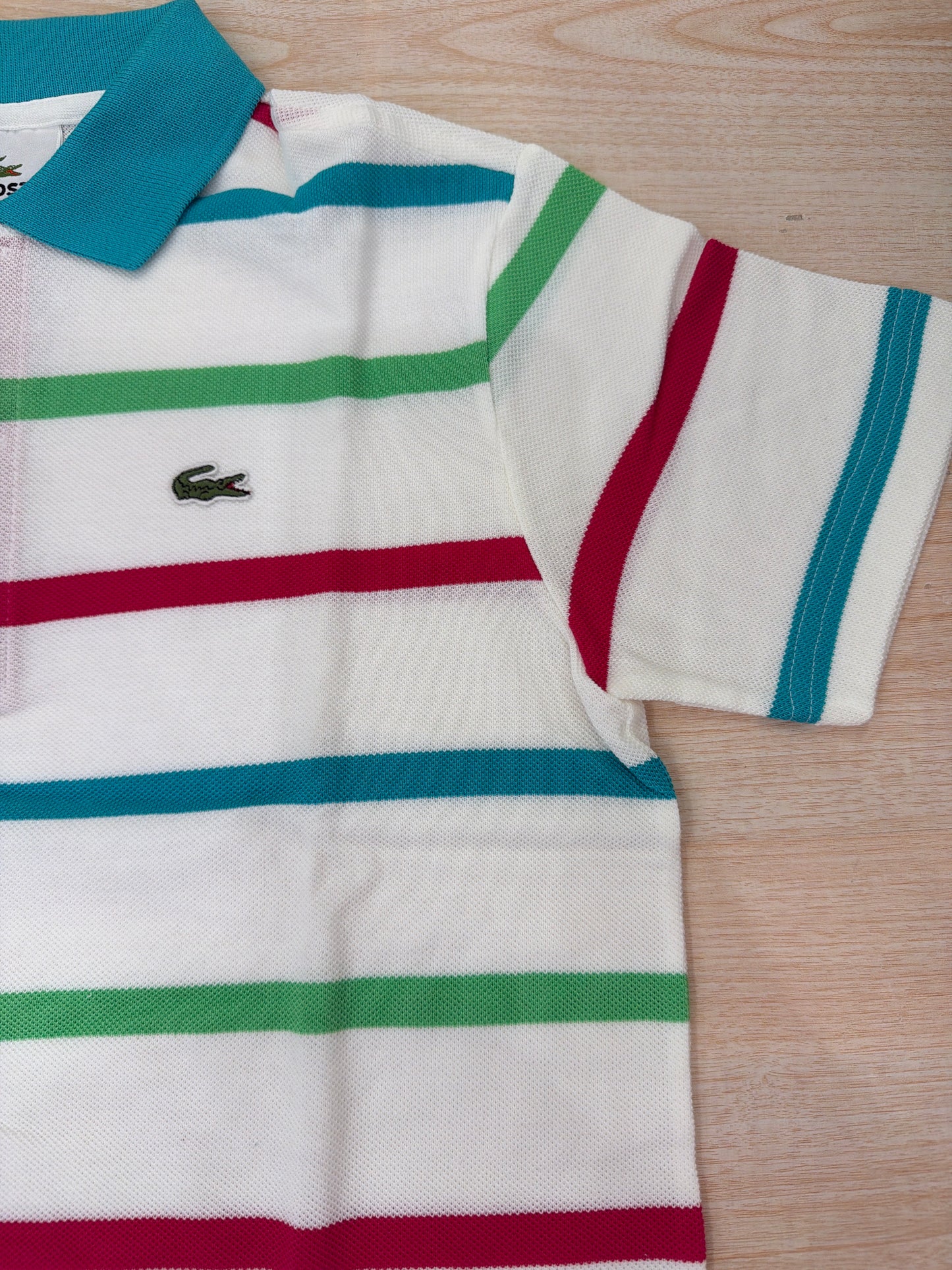 Polo Lacoste in cotone mezza manica con bottoncini e logo ricamato lateralmente unisex