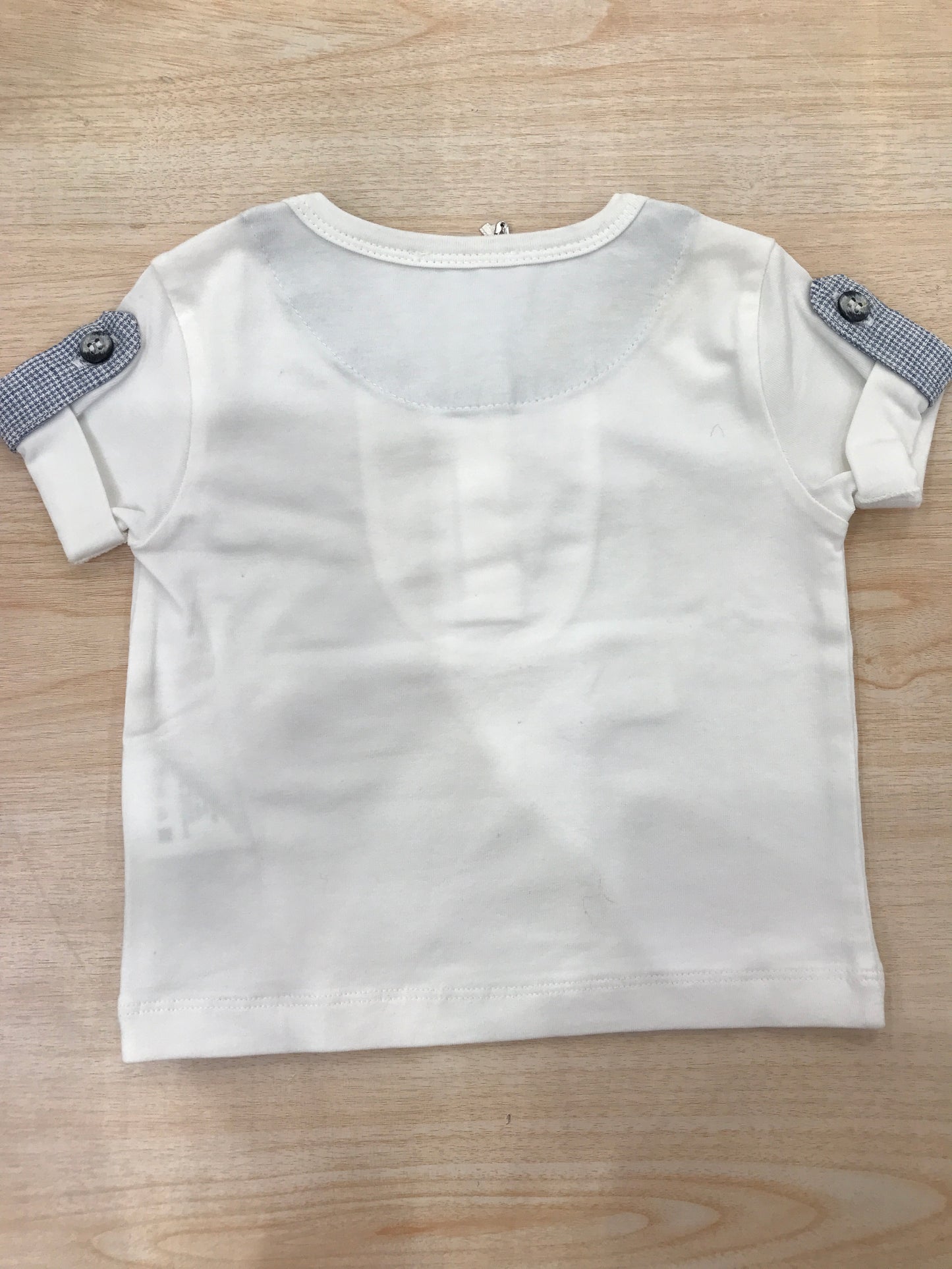 T-shirt Nanan mezza manica in cotone bianca con rifiniture celesti e bianche con bottoncini sul davanti