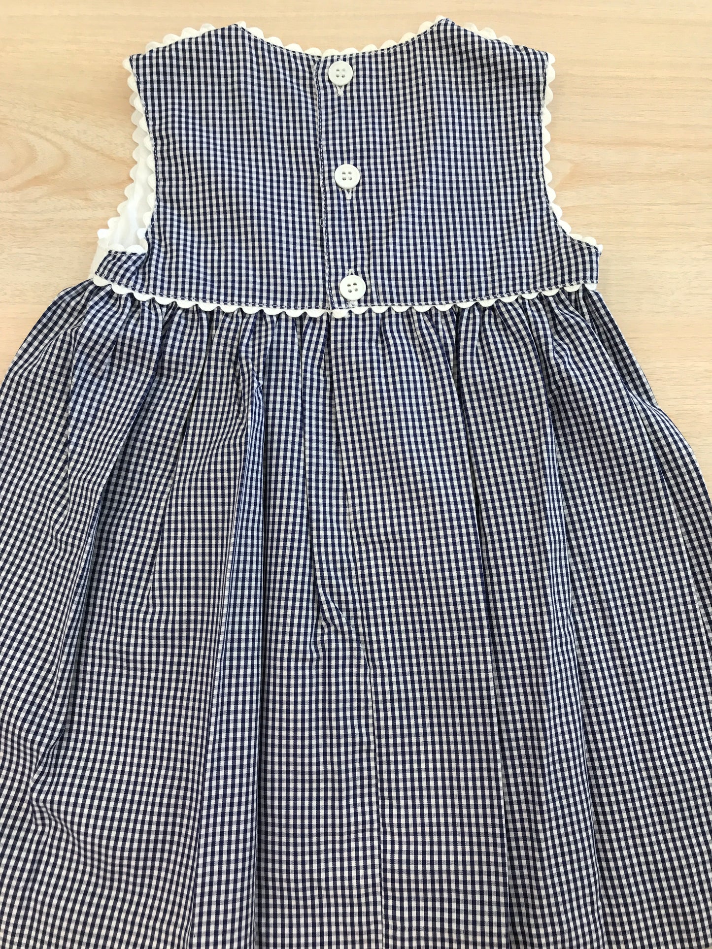 Abito Nicoletta Fanna in cotone a quadretti bianchi e blu con corpetto bianco con fiocco smanicato