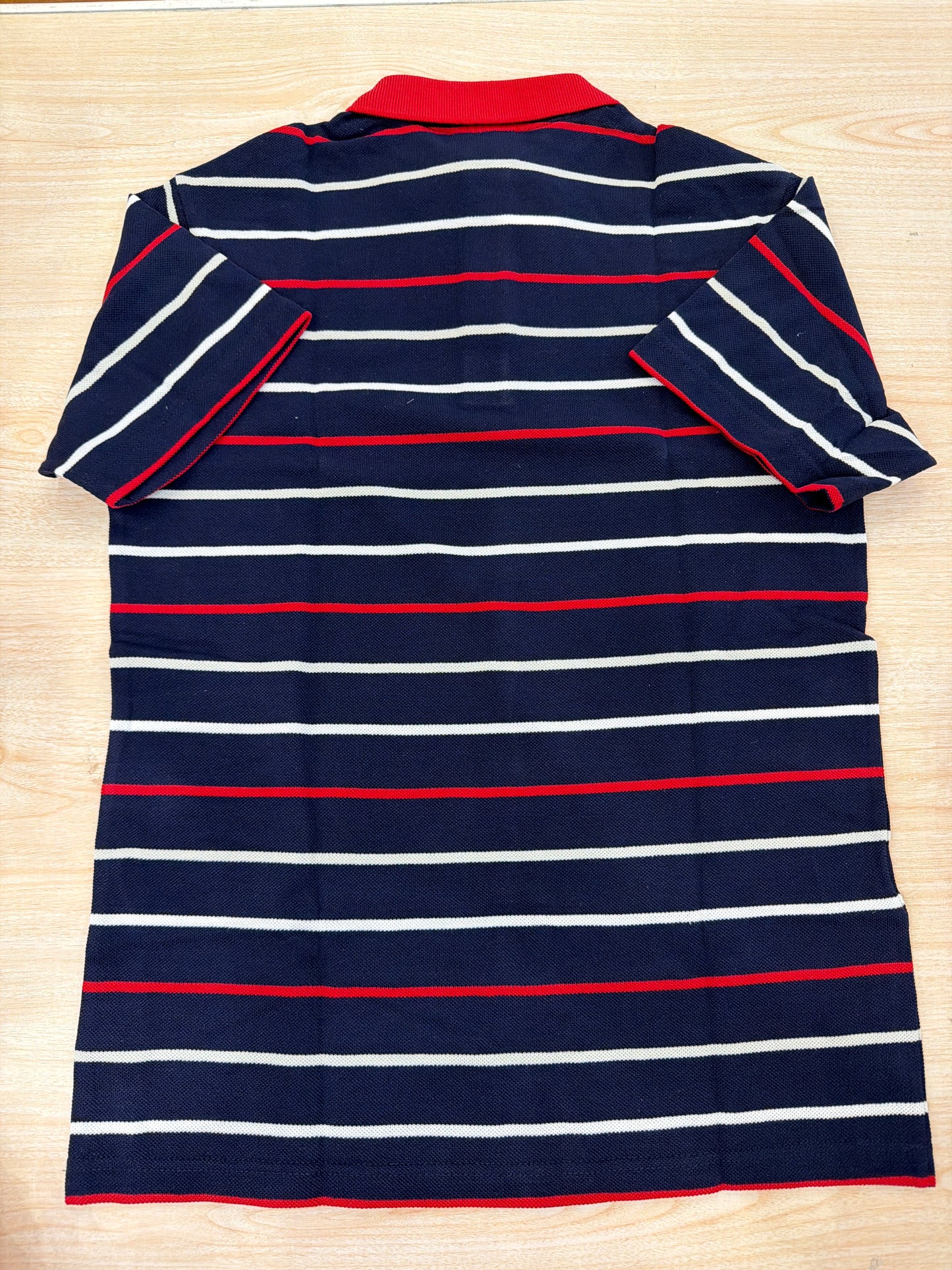 Polo Lacoste in cotone mezza manica con bottoncini e logo ricamato lateralmente unisex