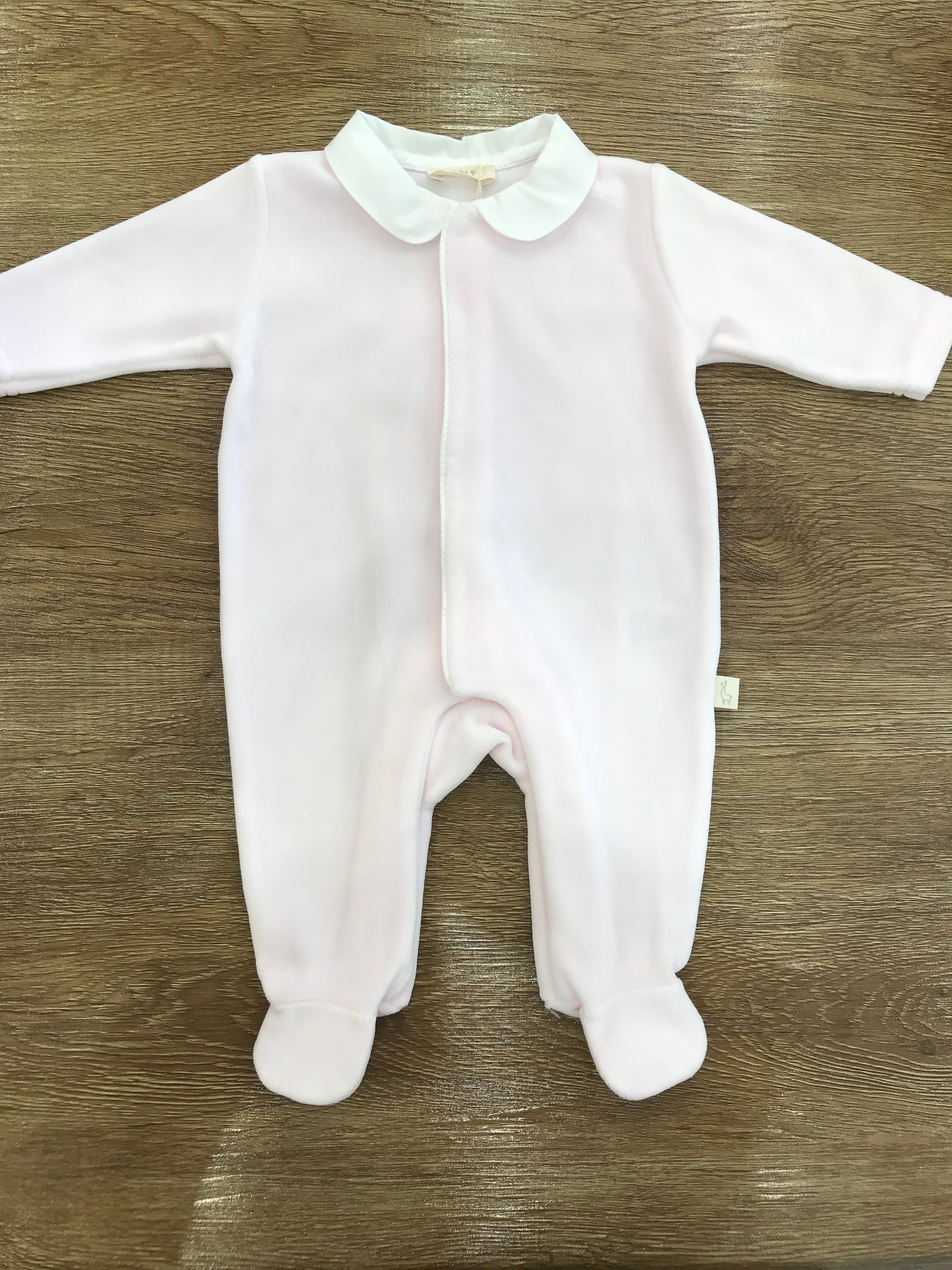 Tutina Baby Gi in ciniglia rosa intera con ali rifinite sul retro
