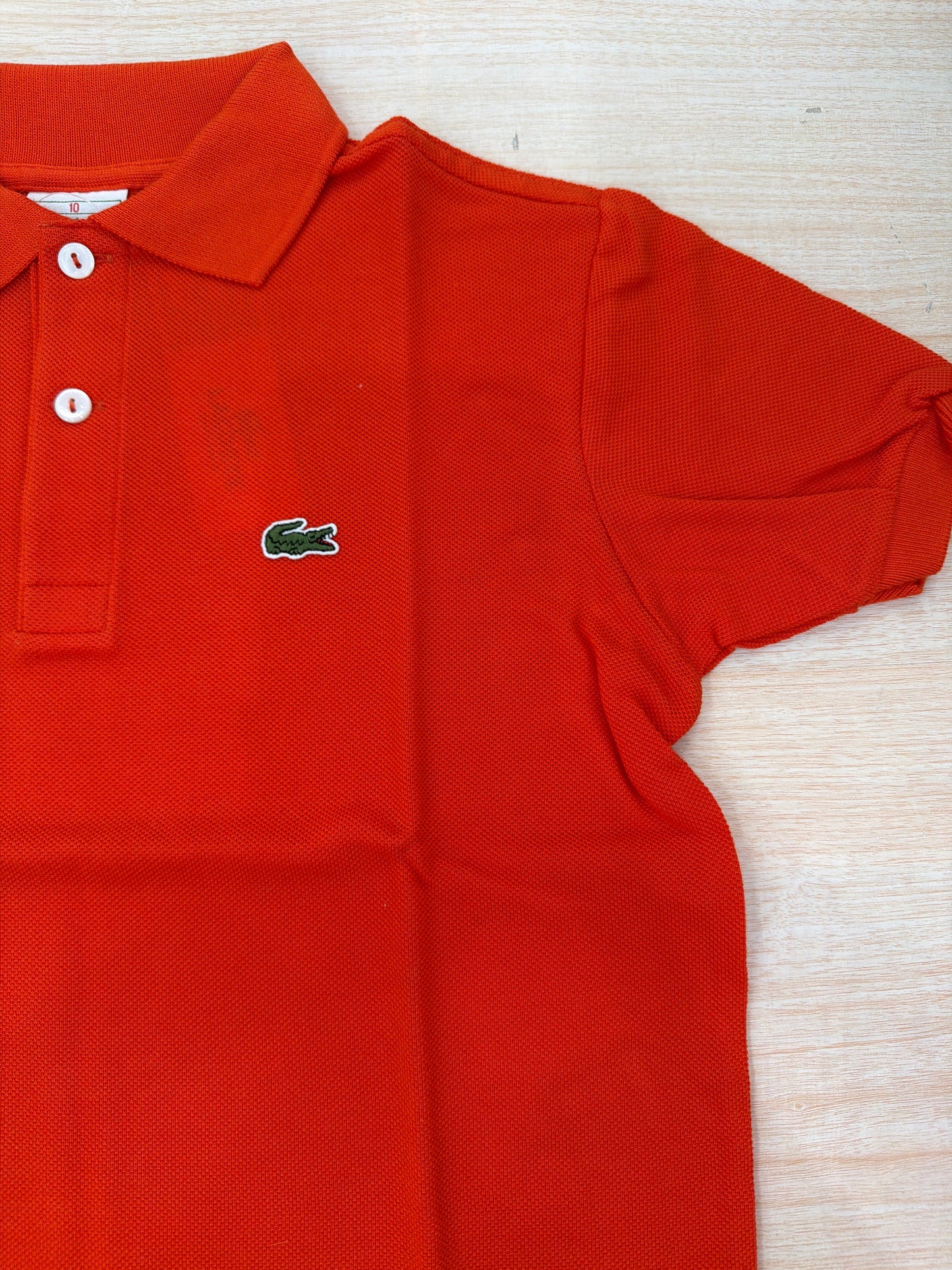 Polo Lacoste in cotone mezza manica con bottoncini e logo ricamato lateralmente unisex