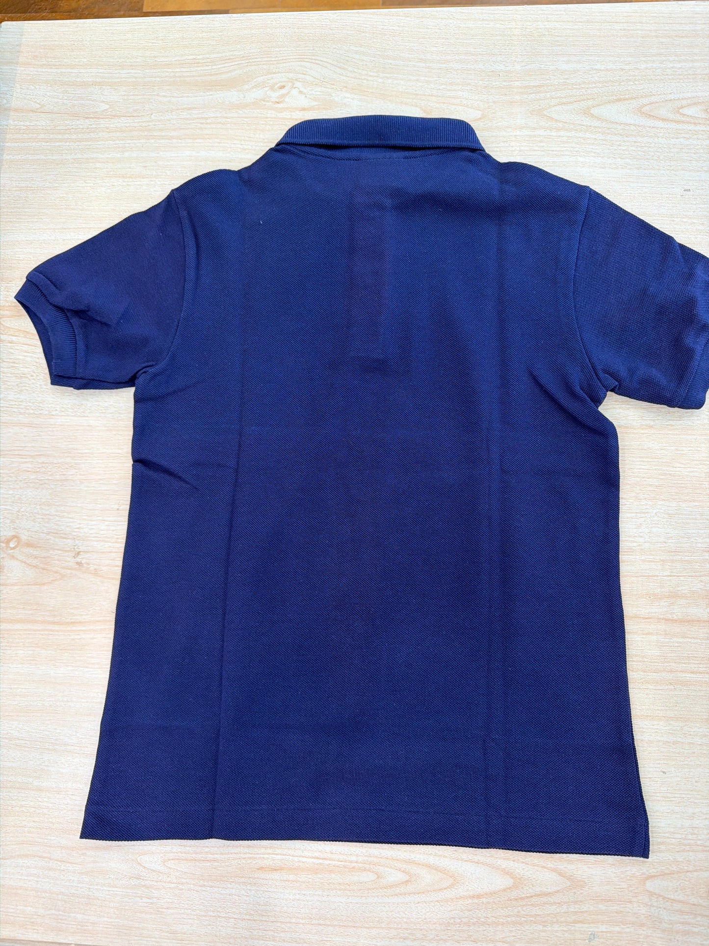 Polo Lacoste in cotone mezza manica con bottoncini e logo ricamato lateralmente unisex