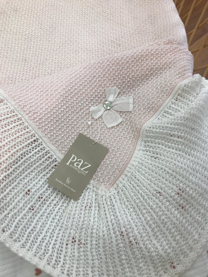 Coperta Paz Rodriguez in lana rosa con bordo con rusche bianca