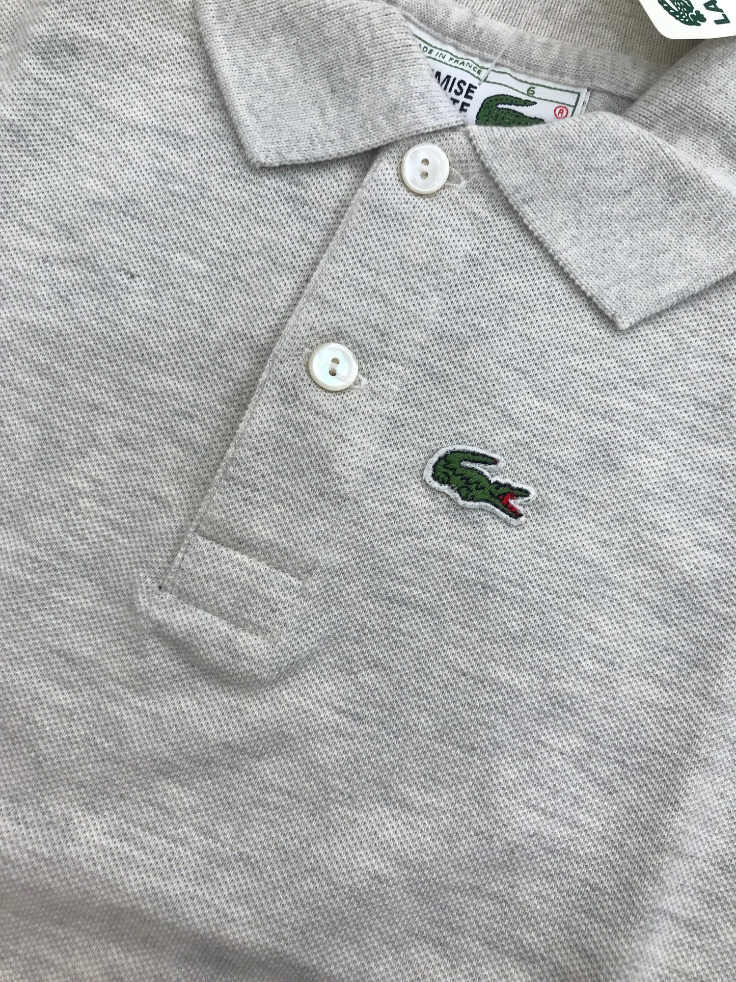 Polo Lacoste mezza manica con polsini e bottoncini
