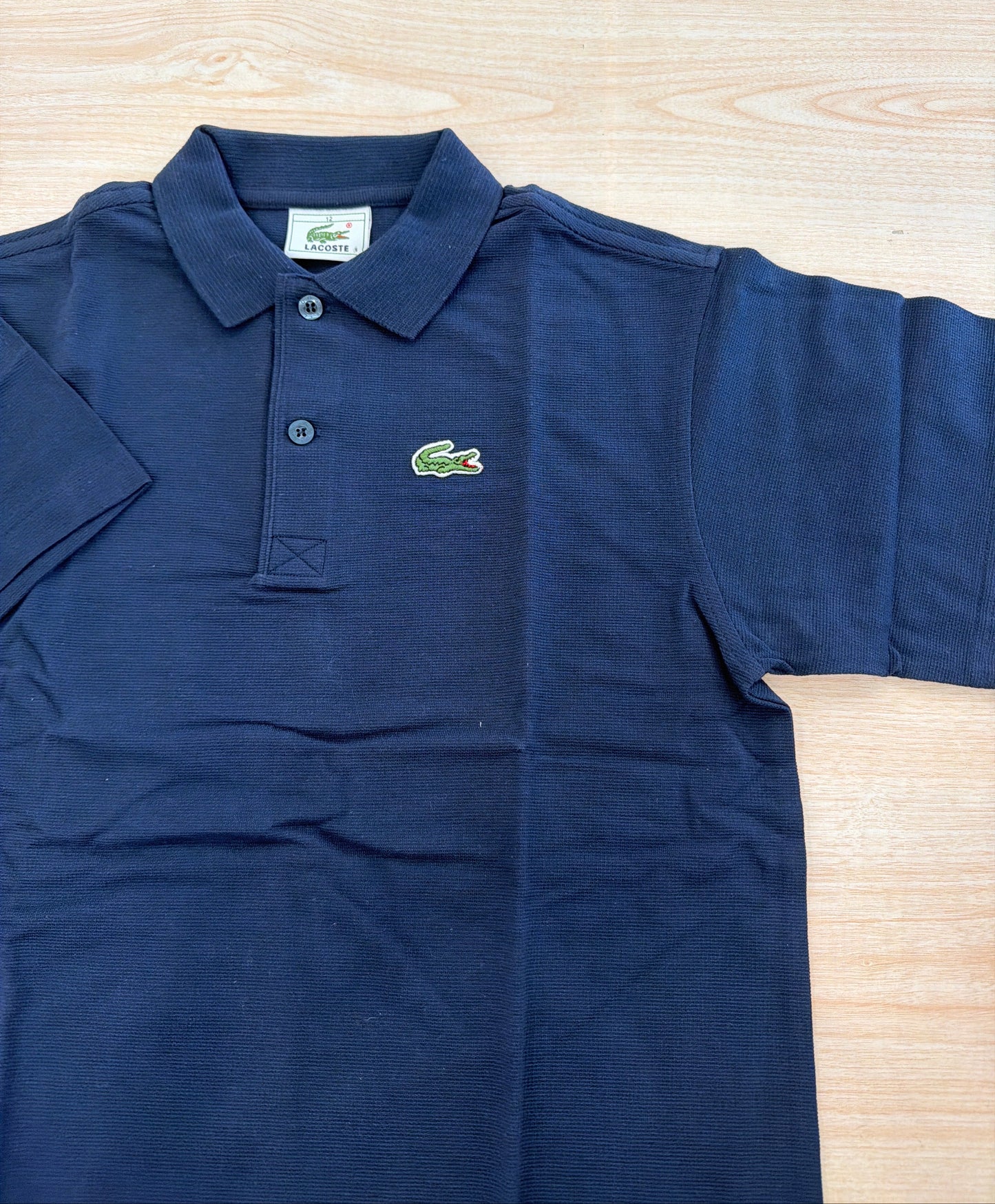 Polo Lacoste in cotone mezza manica con bottoncini e logo ricamato lateralmente unisex
