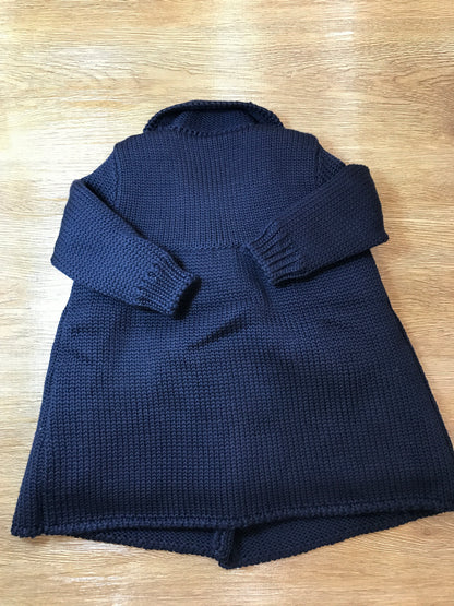 Cappotto Colibrì in lana foderato con piccoli bottoncini doppiopetto e lavorazione di punto smock