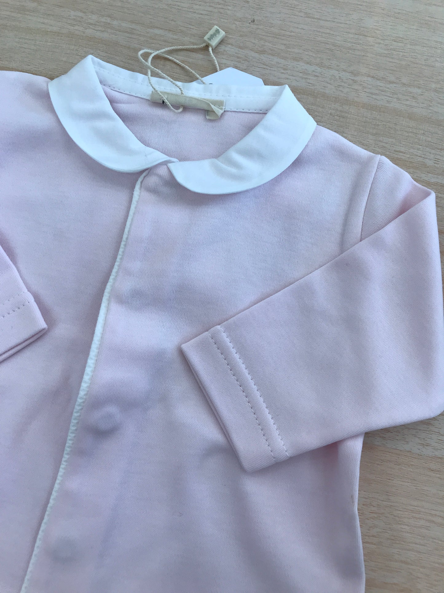 Tutina Baby Gi in cotone manica lunga gamba lunga con piedini con colletto bianco e sul retro ali bianche