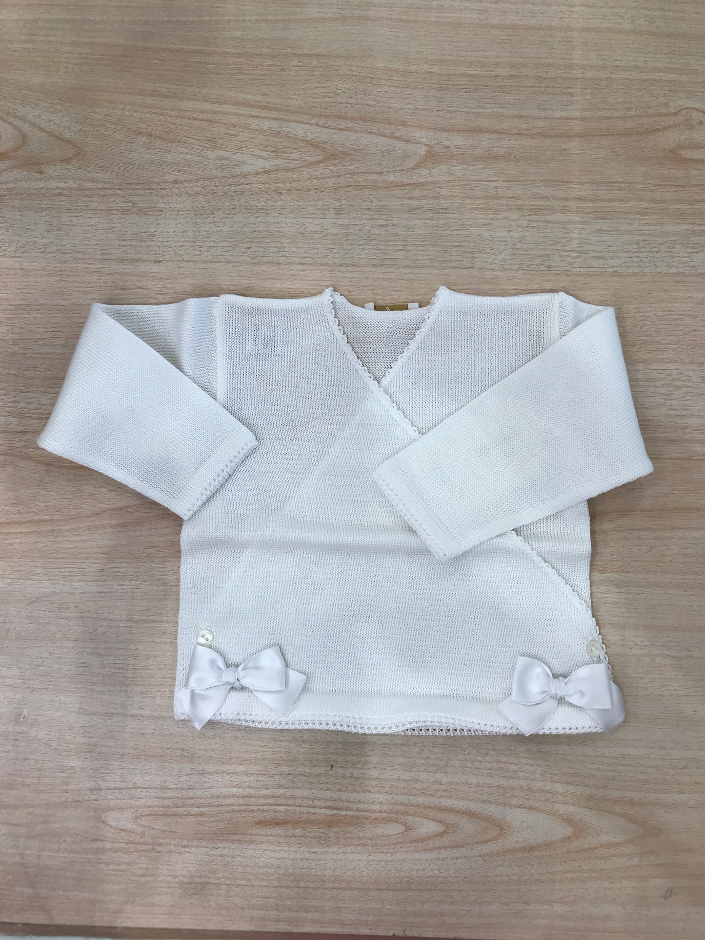 Cardigan Baby Lord in filo bianco ad incrocio con fiocchetti