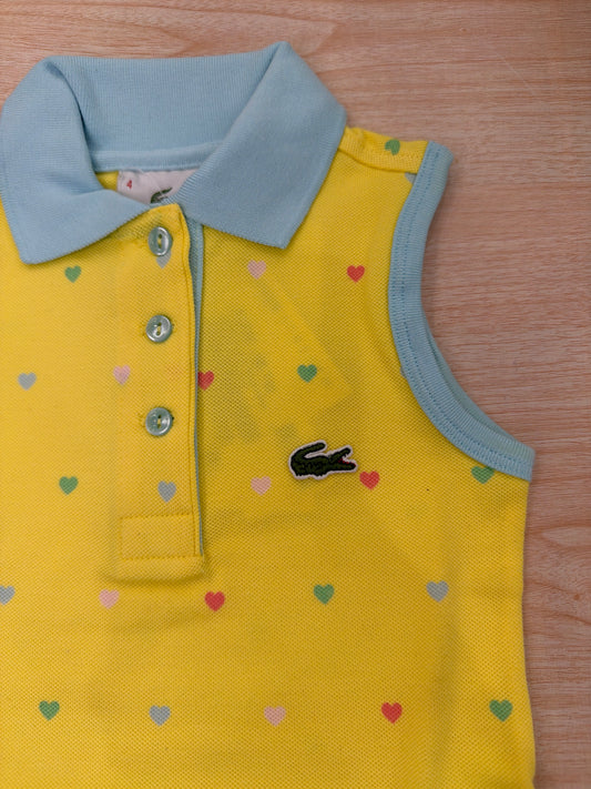 Polo Lacoste in cotone smanicata con bottoncini e logo ricamato lateralmente unisex