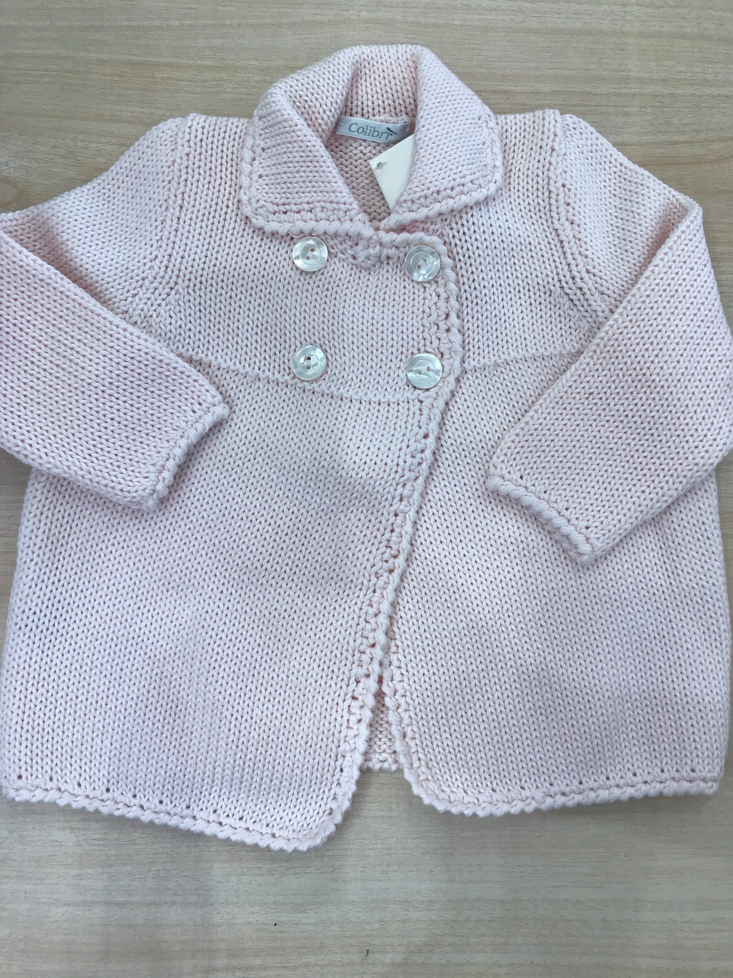 Cappotto Colibrì rosa chiaro in filo con bottoncini doppio petto