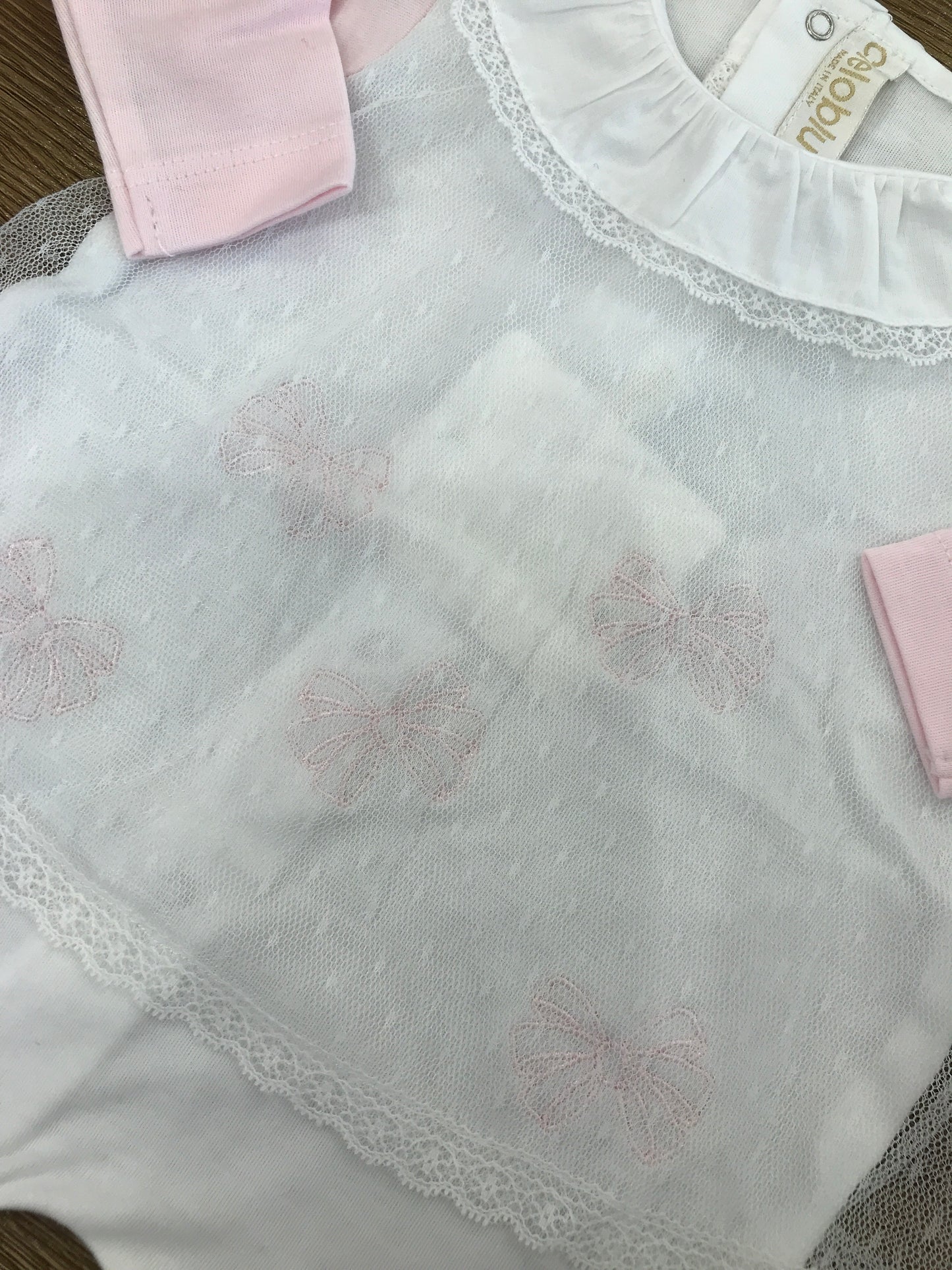 Tutina Cielo Blu intera bianca con fiocchetti rosa e velo in tulle