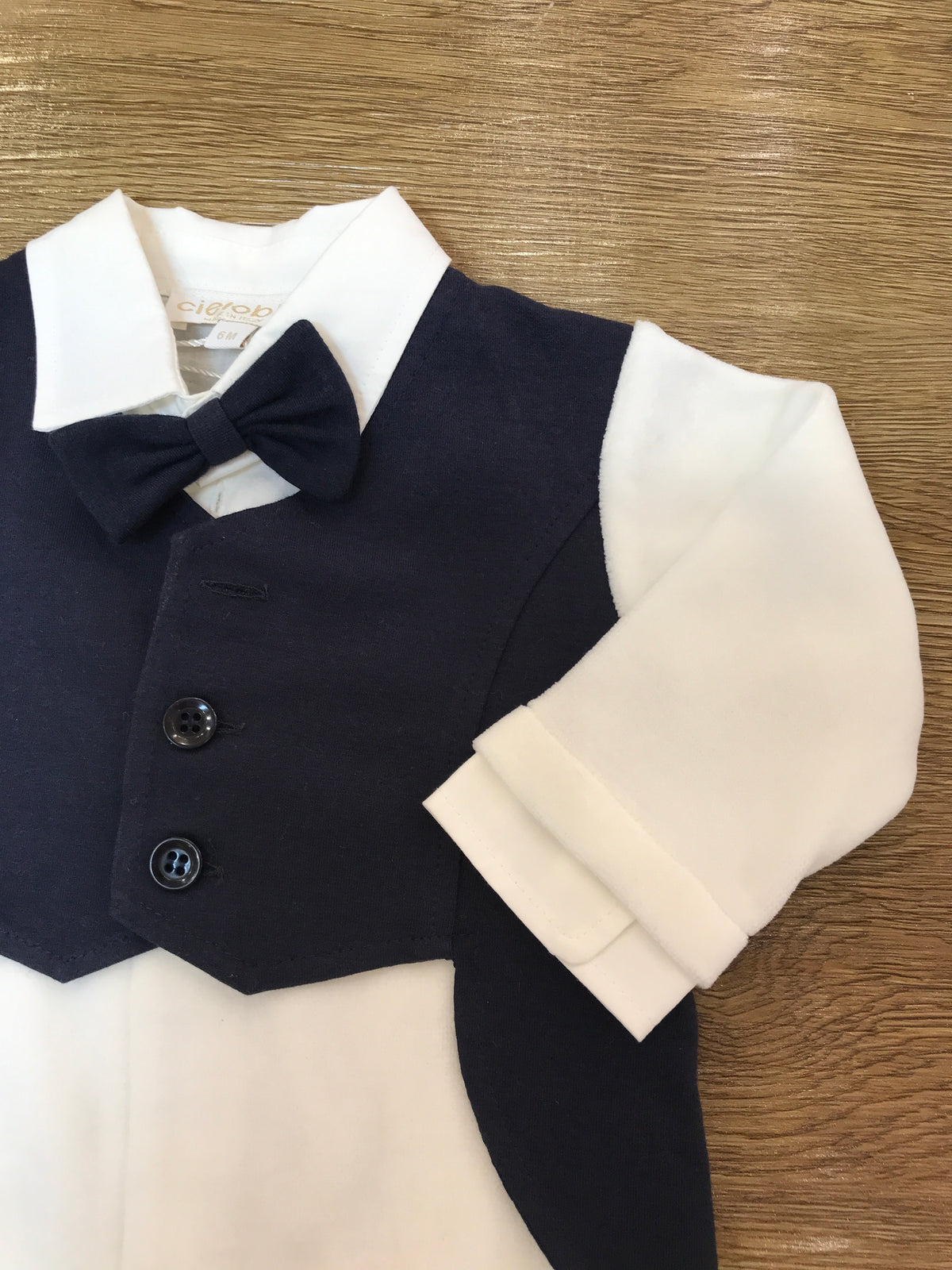 Tutina Cielo Blu in caldo cotone intera bianca con finto gilet blu scuro e papillon
