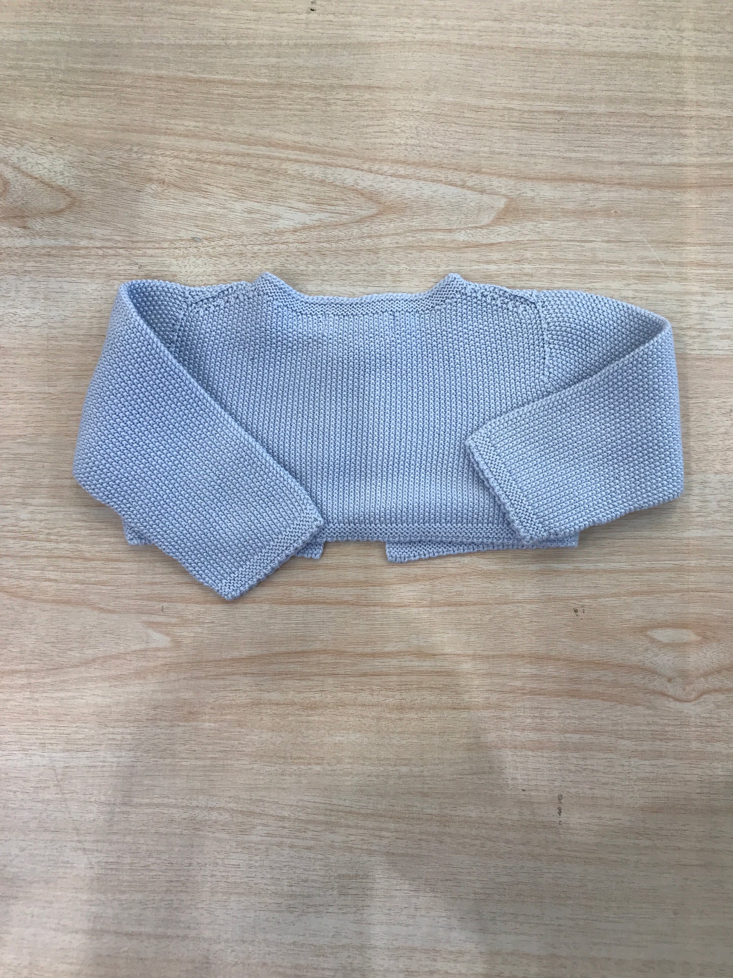 Cardigan Laranjinha in filo con un bottoncino