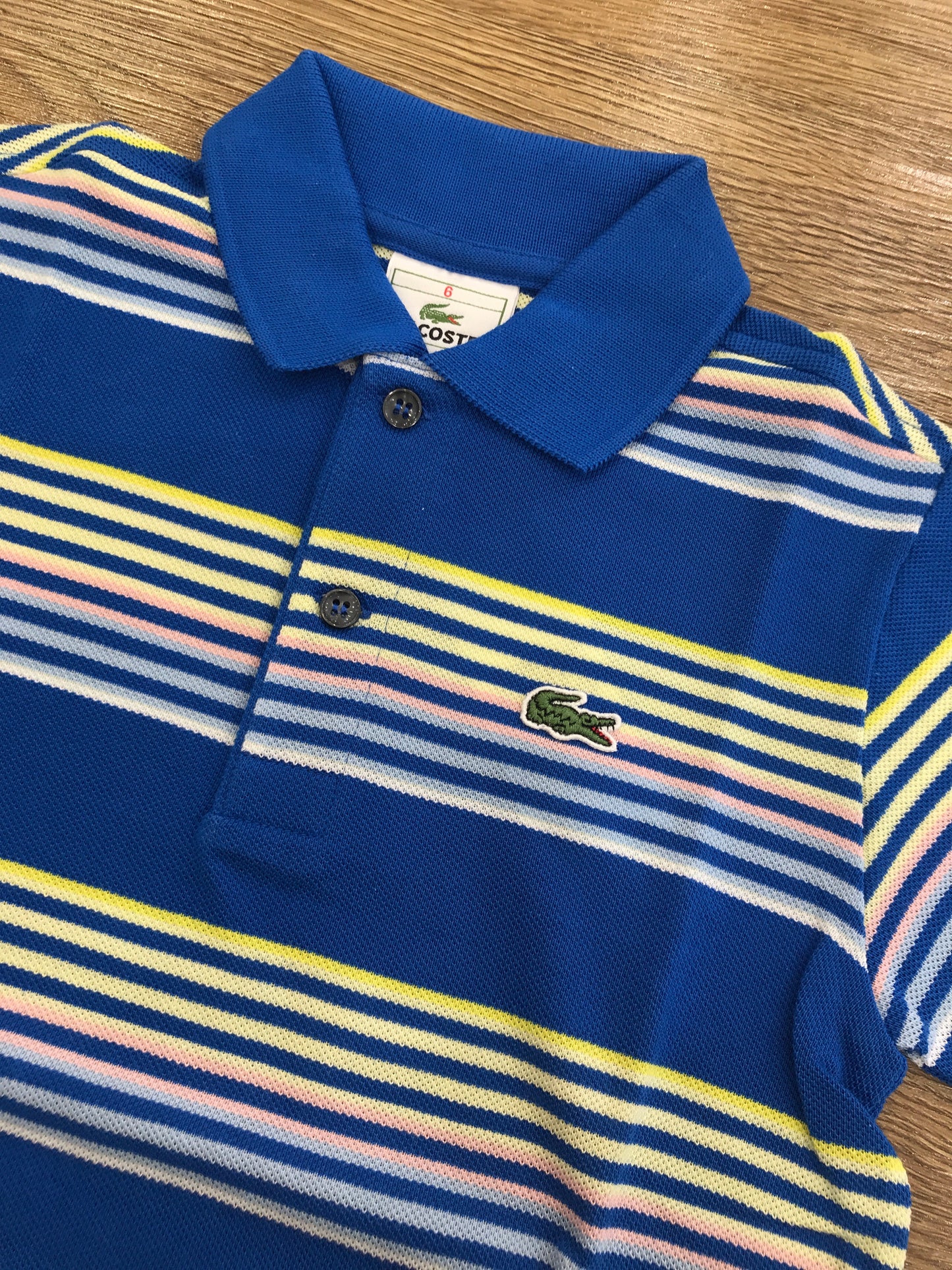 Polo Lacoste mezza manica  a righe con polsini e bottoncini