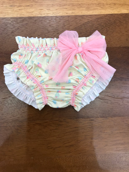 Costume Paz Rodriguez giallo con fragoline con rusche con fiocco rosa laterale