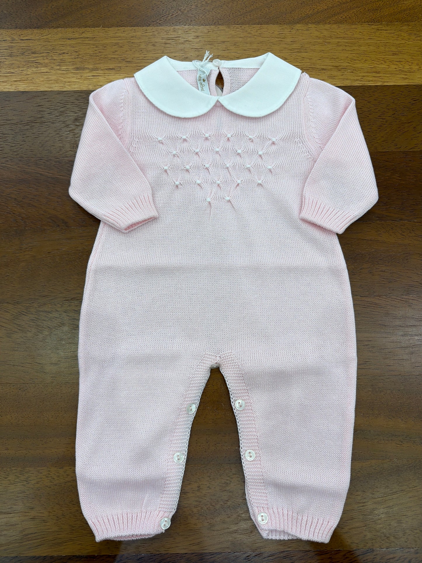 Tutina Baby Lord in filo manica lunga rosa con lavorazione di punto smock bianco