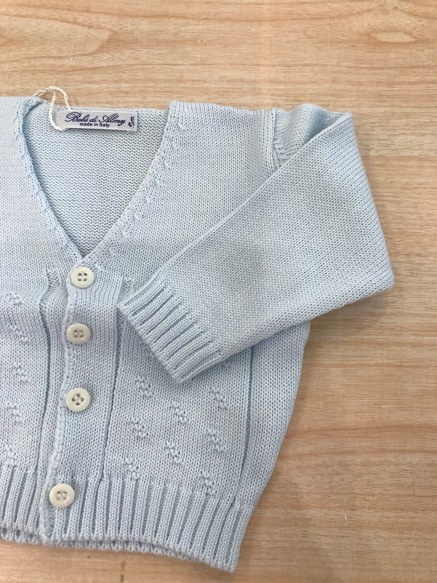 Cardigan Bebè di Almy in filo manica lunga con lavorazione sul davanti