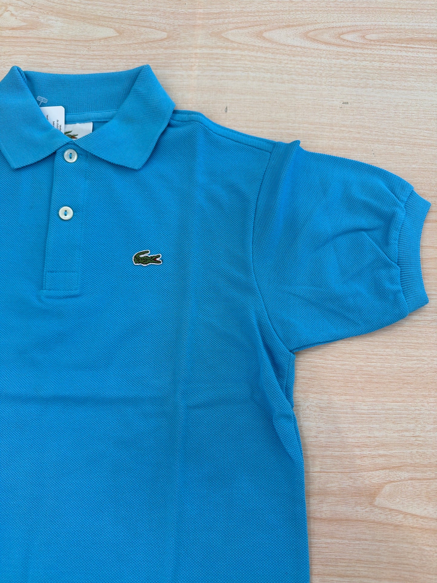Polo Lacoste in cotone mezza manica con bottoncini e logo ricamato lateralmente unisex