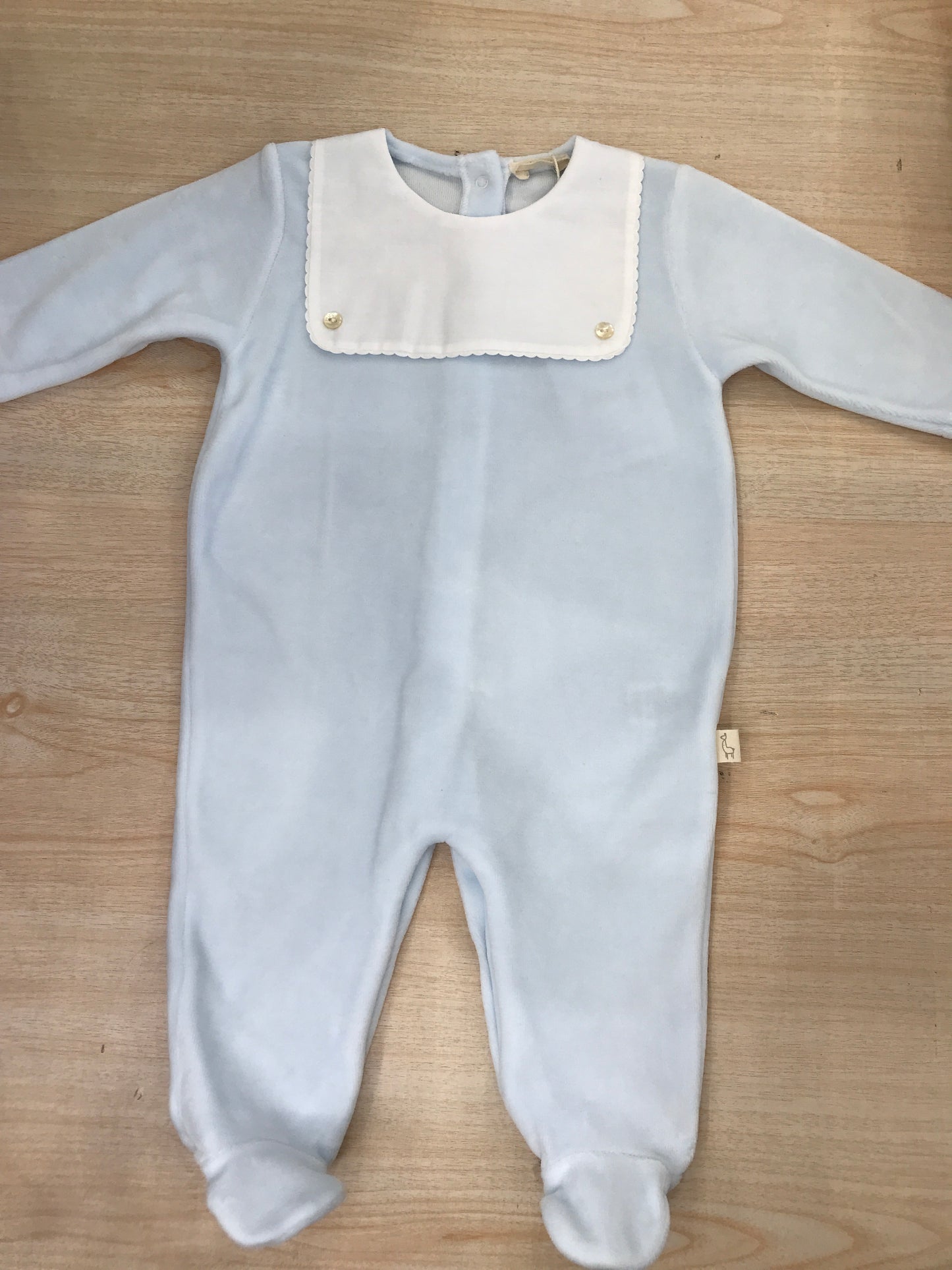 Tutina Baby Gi in ciniglia celeste intera con dettaglio bianco smerlato effetto bavetta