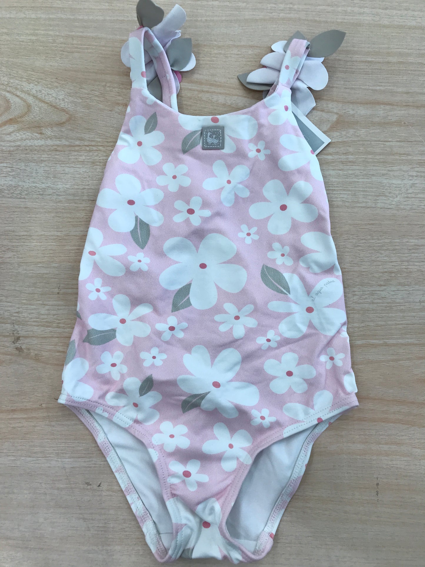 Costume Al agua Patos rosa con fiorellini bianchi e fiori in rilievo applicati sulle bretelle