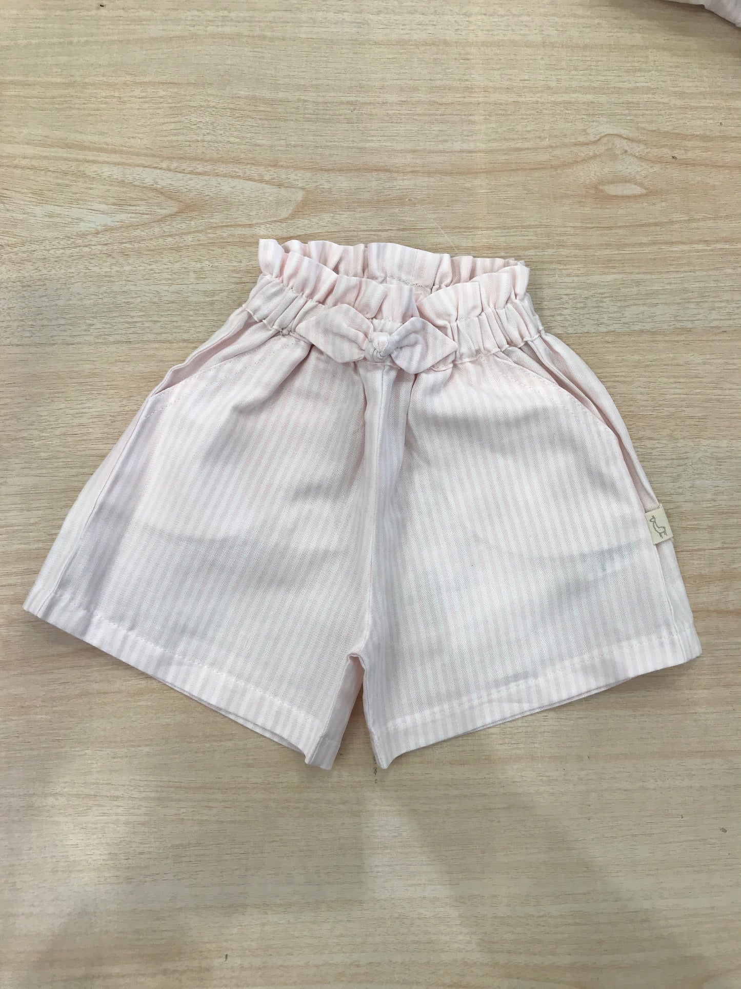 Pantalone Baby Gi in cotone a righe bianche e rosa con fiocchetto ed elastico in vita