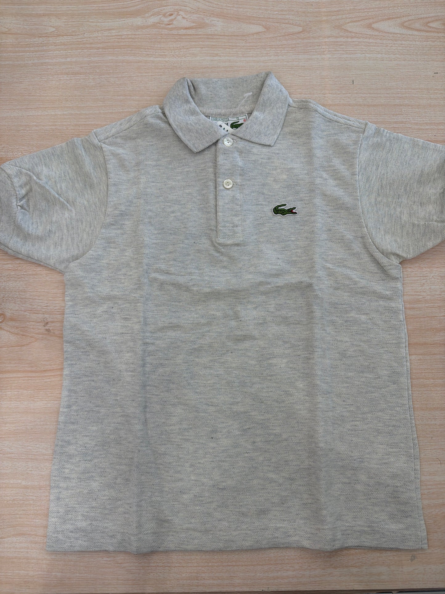 Polo Lacoste in cotone mezza manica con bottoncini e logo ricamato lateralmente unisex