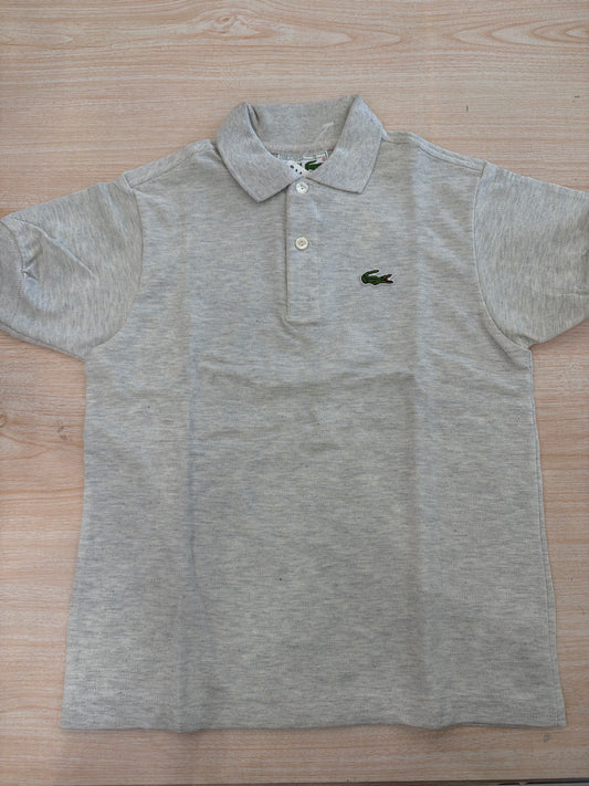 Polo Lacoste in cotone mezza manica con bottoncini e logo ricamato lateralmente unisex
