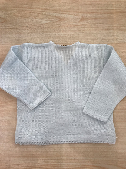 Cardigan Baby Lord in filo celeste ad incrocio con fiocchetti bianchi