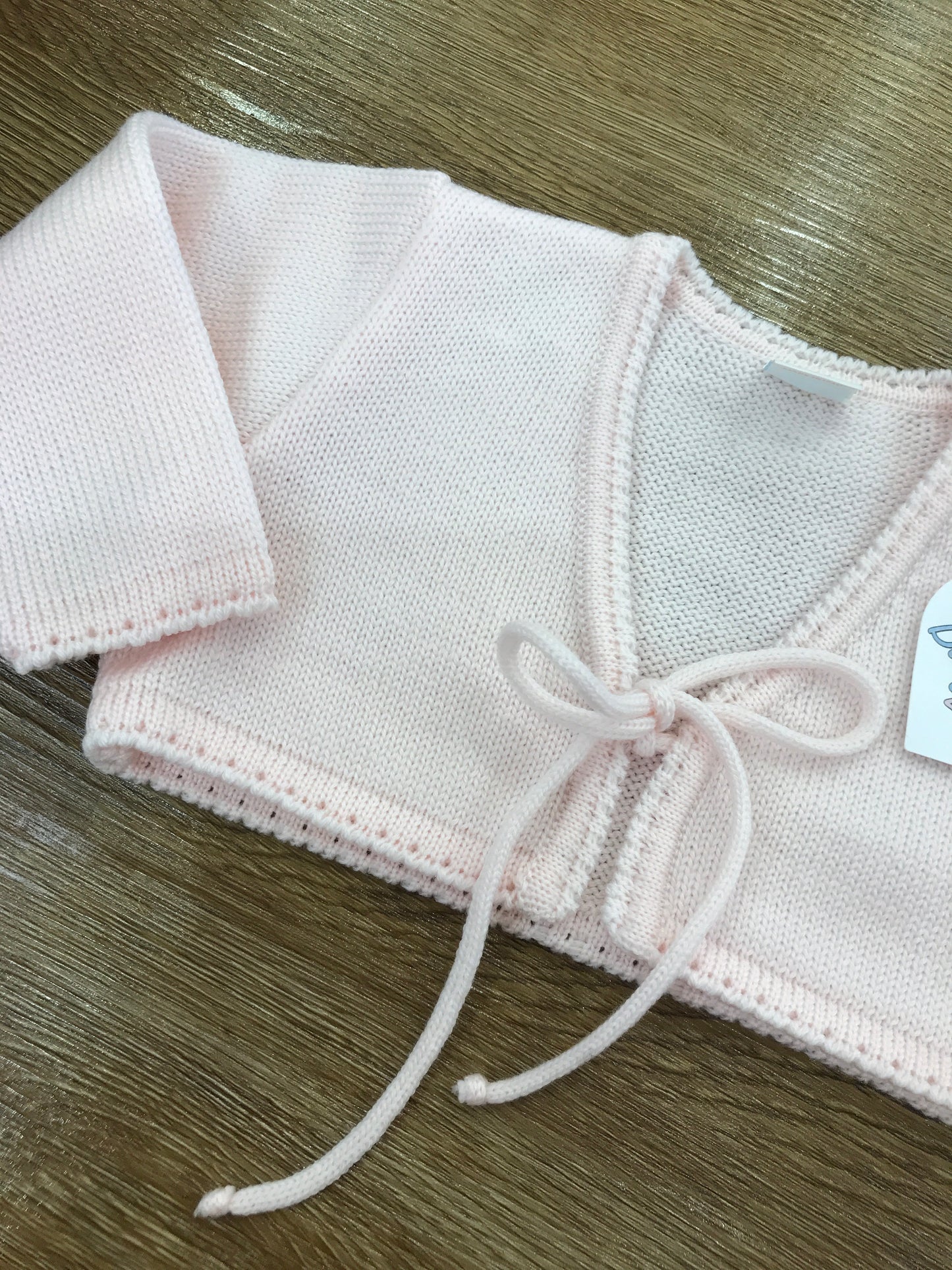 Cardigan Baby Lord in lana rosa con fiocchetto per chiusura