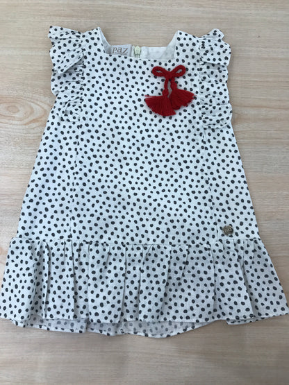 Abito Paz Rodriguez in cotone bianco con pois neri smanicato con rusche con nappina rossa laterale